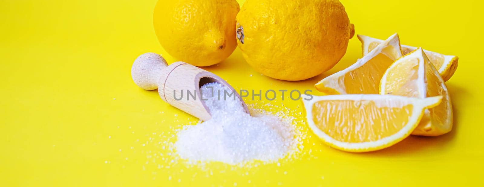 Citric acid on a yellow background. Selective focus. by mila1784