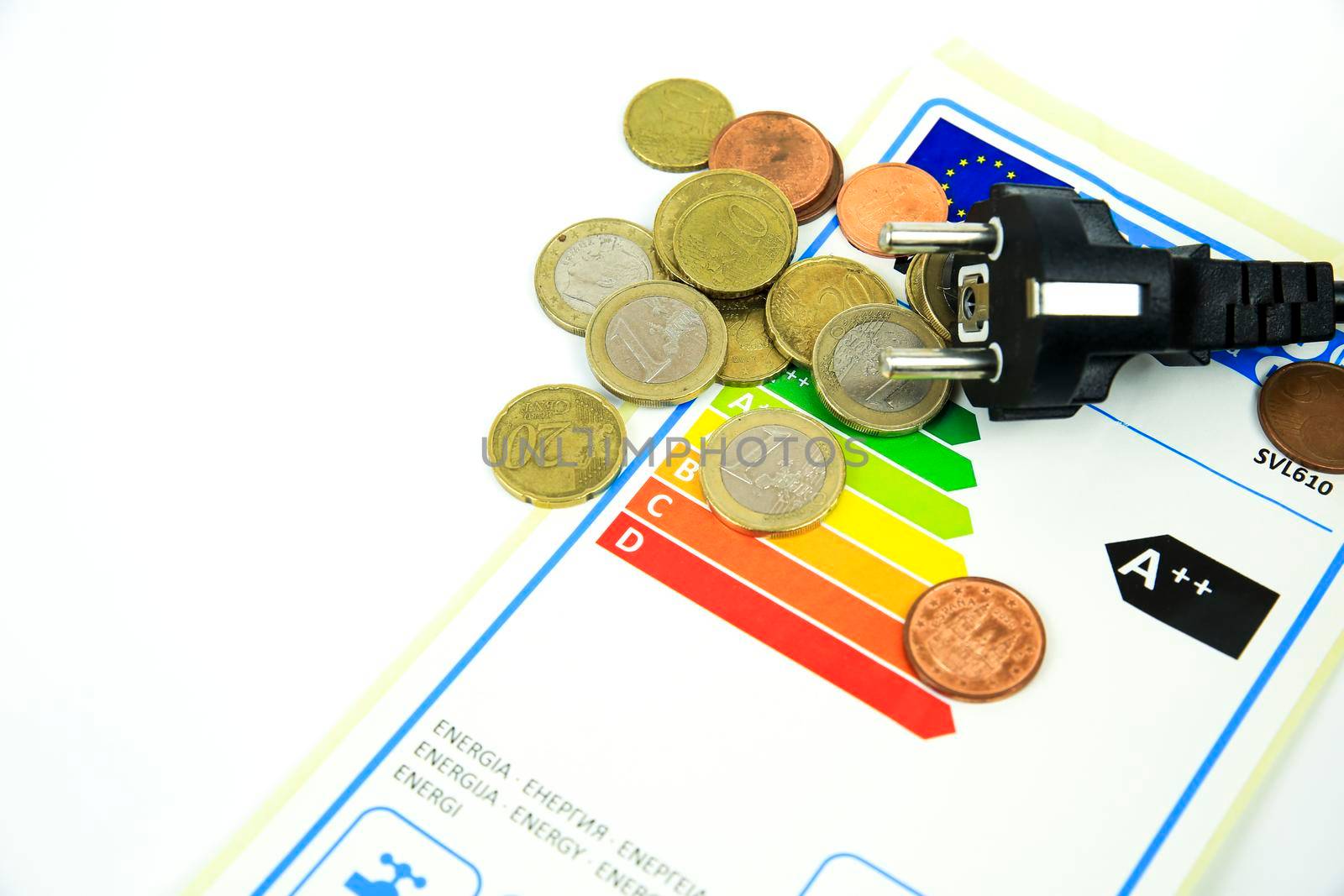 Madrid, Spain- May 9, 2022: European Union Energy Label next to black pin power plug and coins