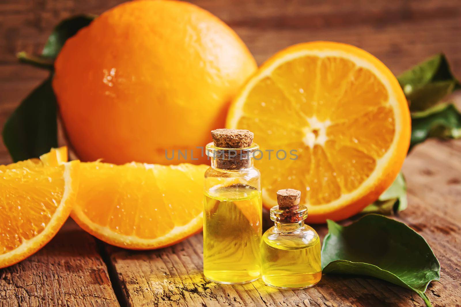 Essential aroma oil with citrus on wooden background. Selective focus.nature