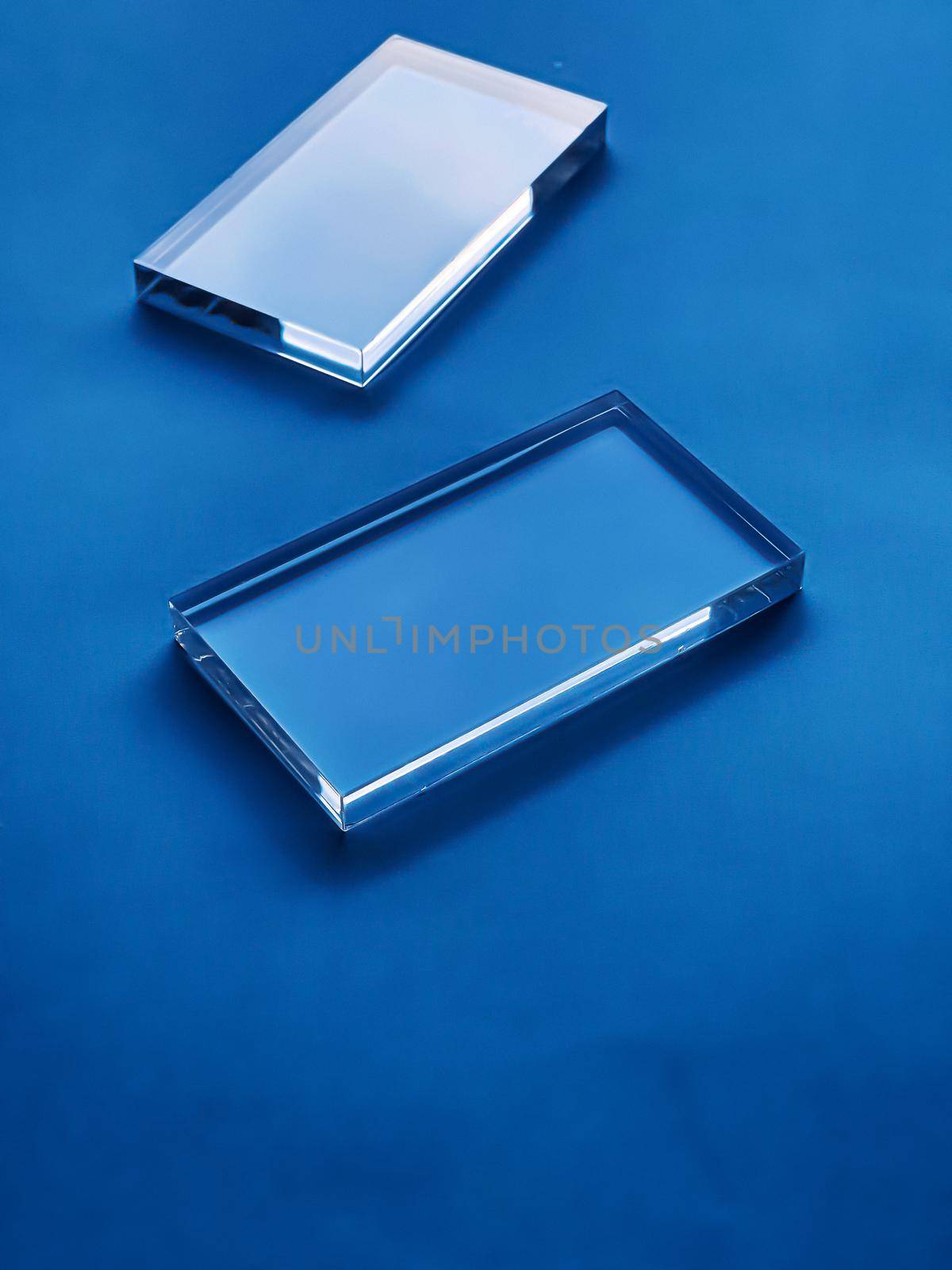 Transparent glass device on blue background, future technology and abstract screen mockup design by Anneleven