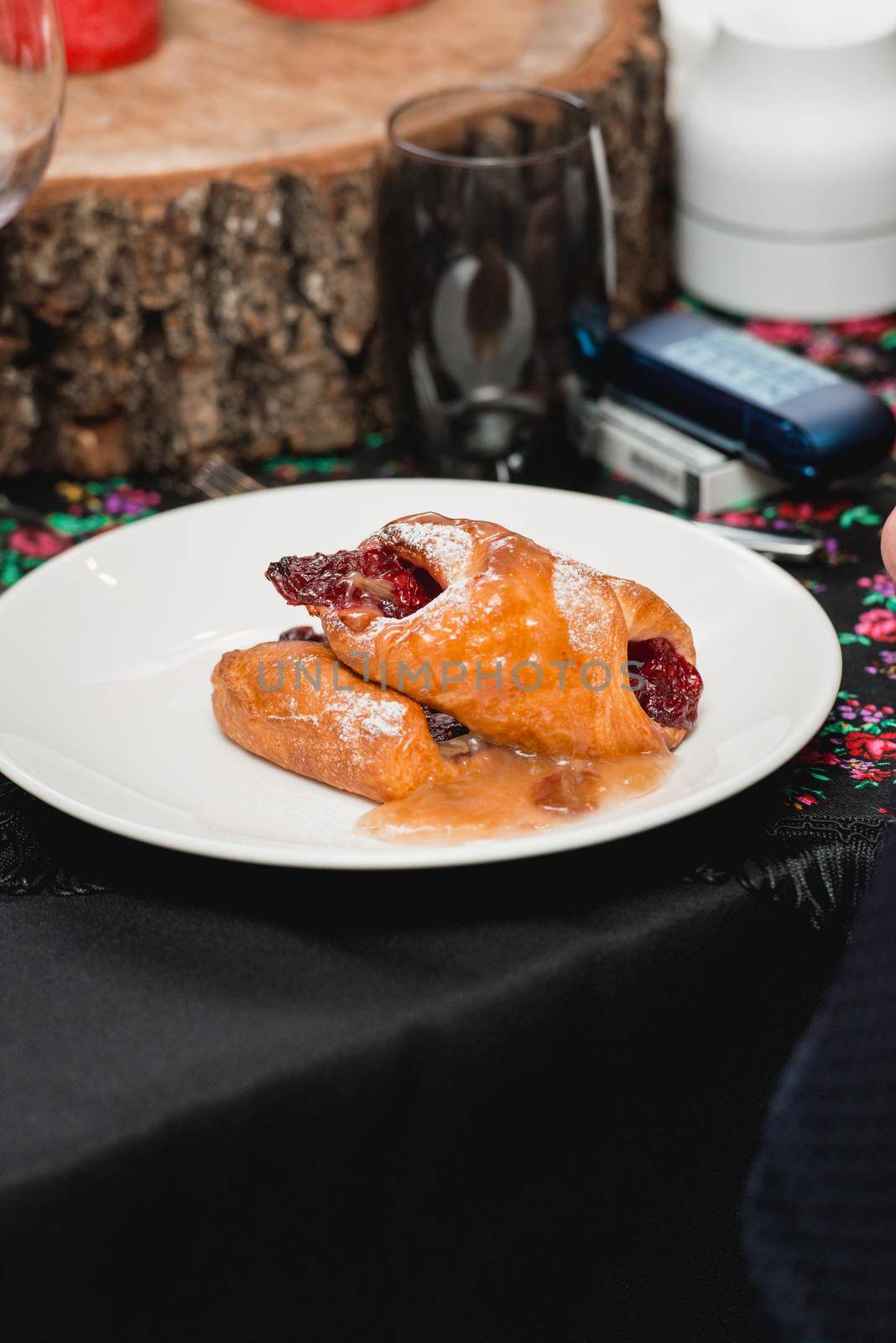 flying buns with fruits on a white plate.