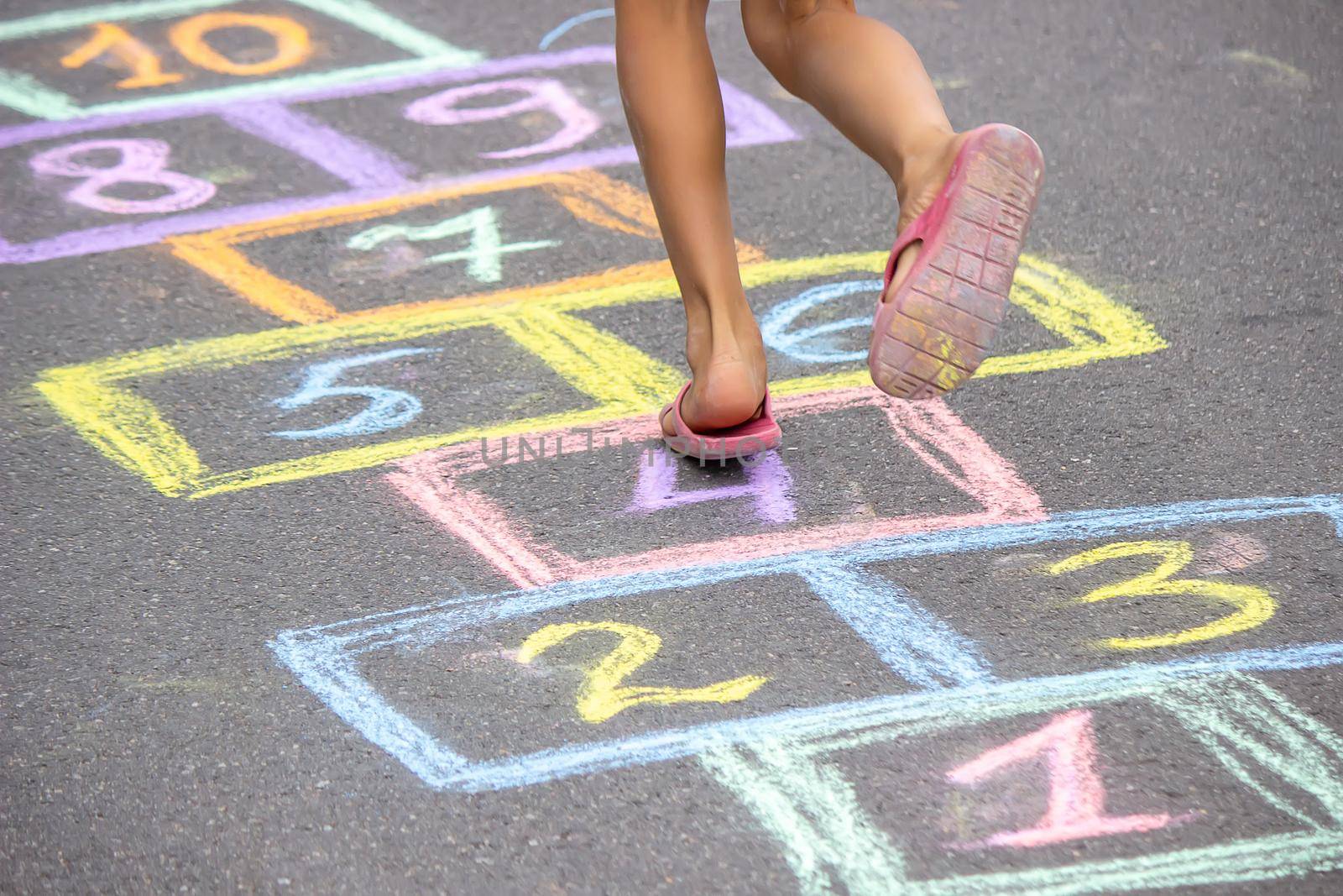 little girl plays hopscotch. Nature. selective focus