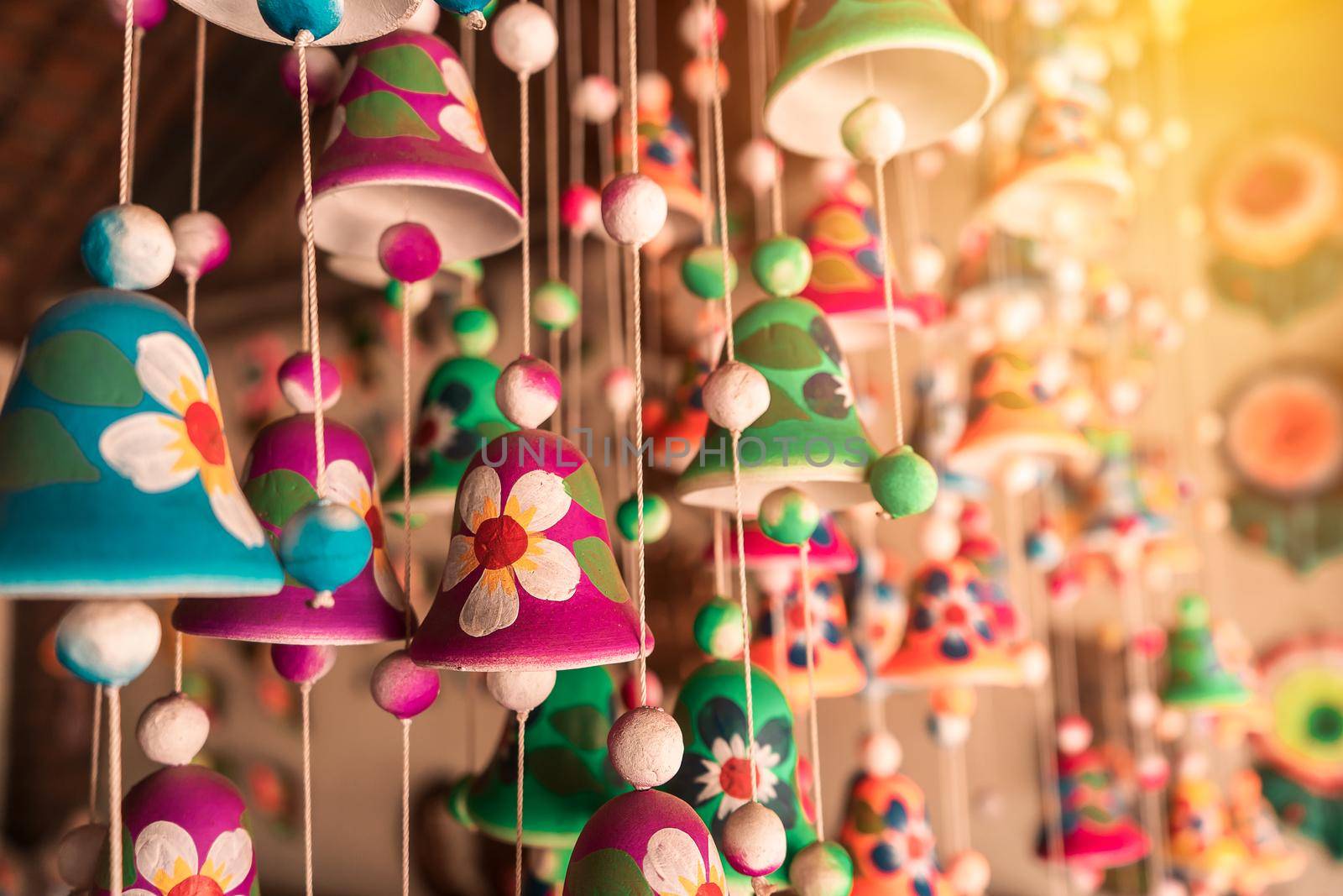 Clay bells hanging in a craft store in La Paz Centro Nicaragua. Concept of travel memories in tourist cities and magical towns of Latin America.