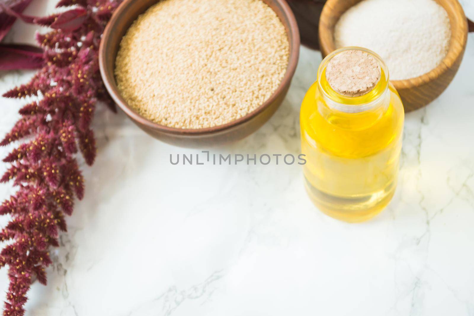 amaranth grain with oil on a white background with space for text. High quality photo