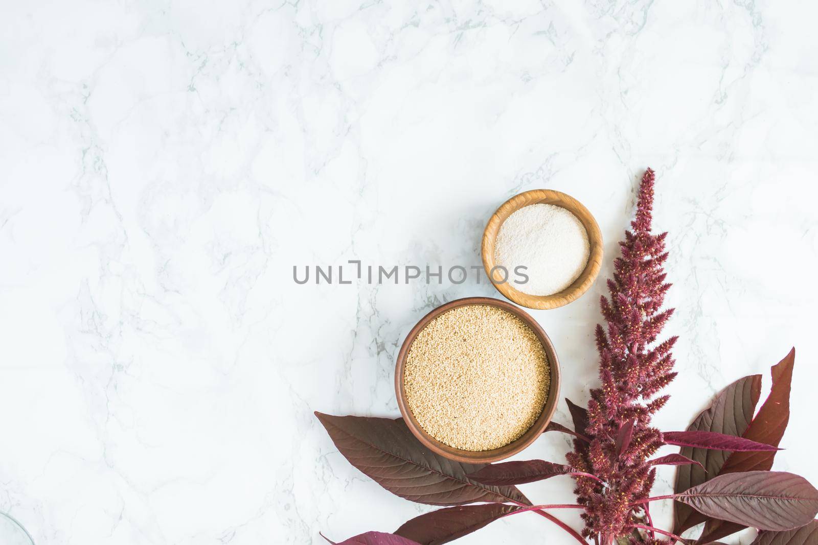 amaranth grain with oil on a white background with space for text. High quality photo