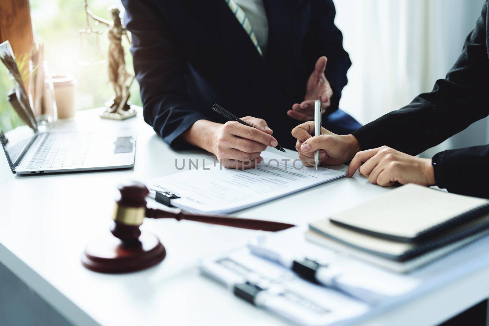 Law, Consultation, Agreement, Contract, Attorney or Lawyer holding a pen is consulting with a client to explain the pattern of answering questions before going to court to decide a lawsuit