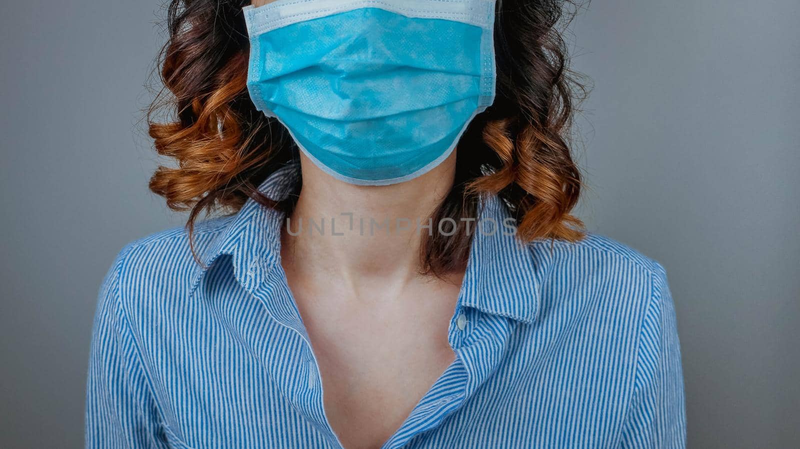 Woman wearing protection face mask against coronavirus. Medical mask, Surgical mask, Close up shot, Select focus, Prevention from covid19