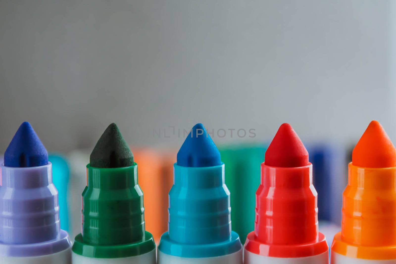 Colorful rainbow markers with blurred background. Close view by JuliaDorian
