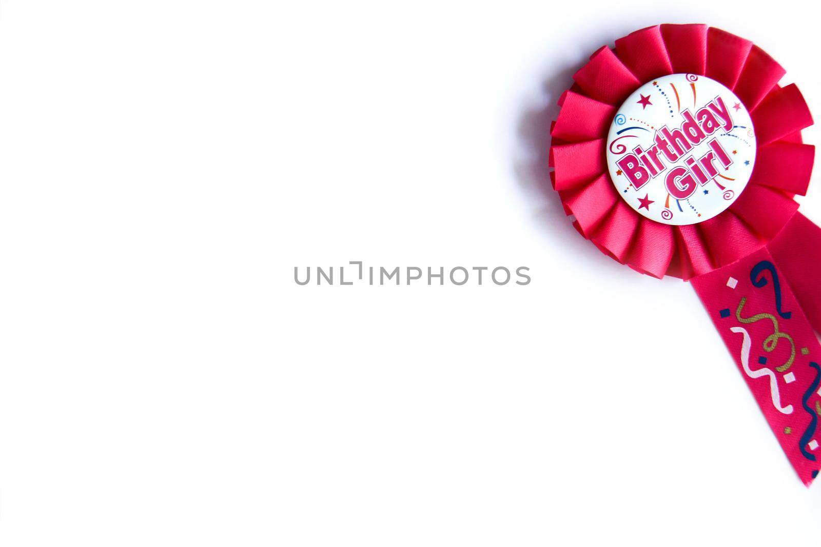 Pink birthday rosette. Happy birthday wishes for a girl on a pink badge on white background by JuliaDorian