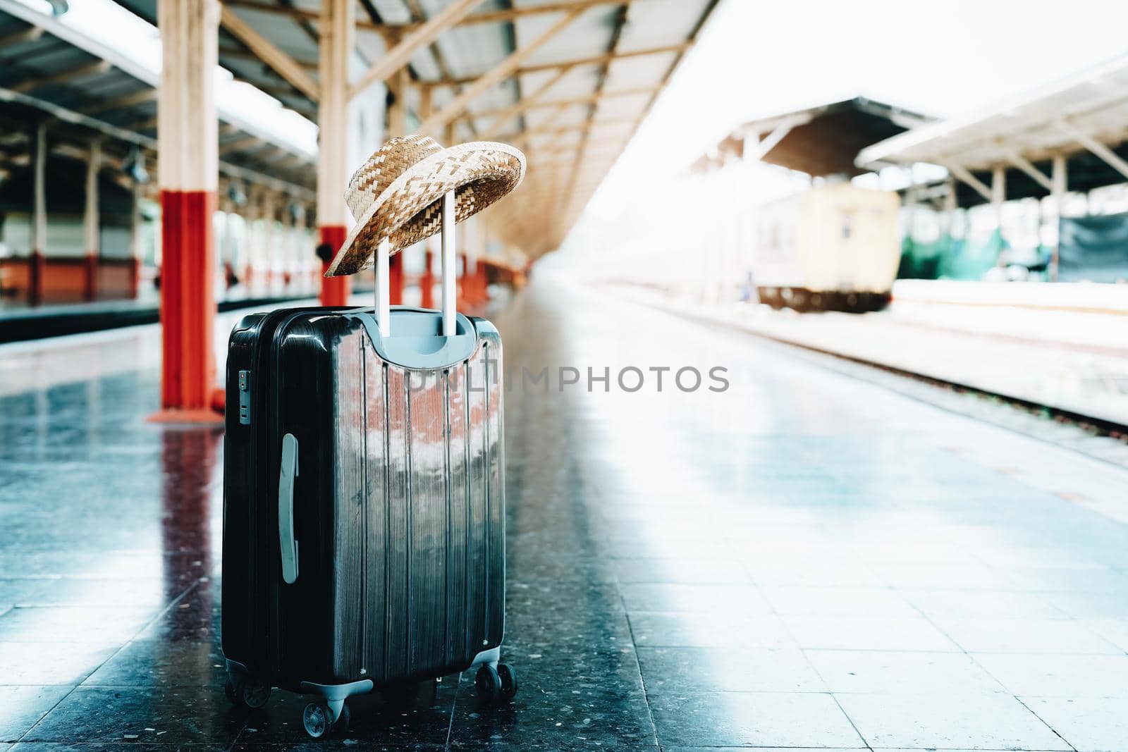 summer, relax, vacation, travel, focus on hat and luggage asian girl waiting sitting for the train to travel while waiting at the train station by Manastrong