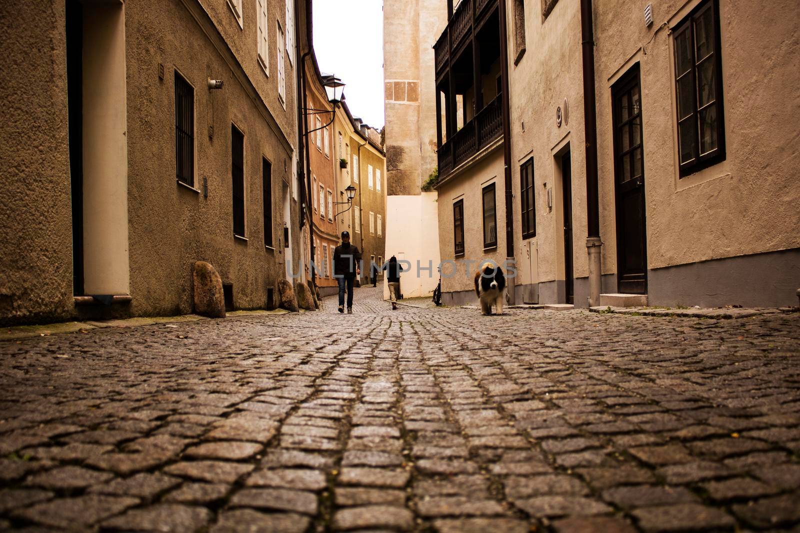 People walking in an old town by ValentimePix