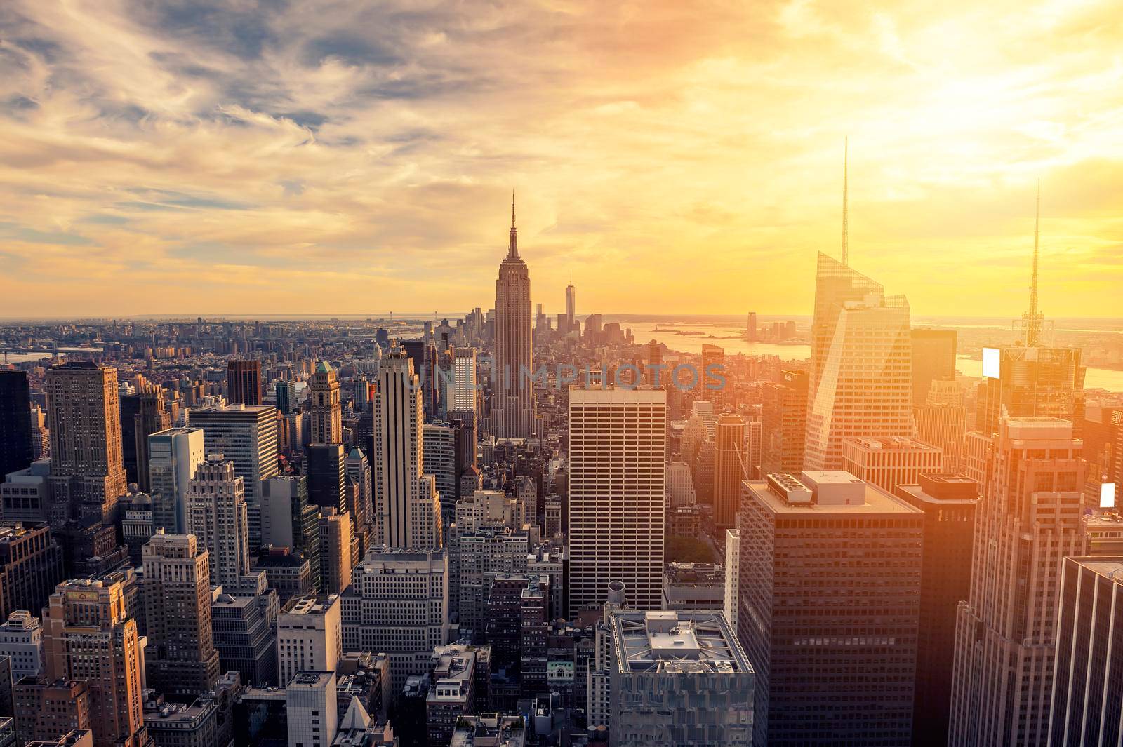 New York City skyline with urban skyscrapers at sunset.