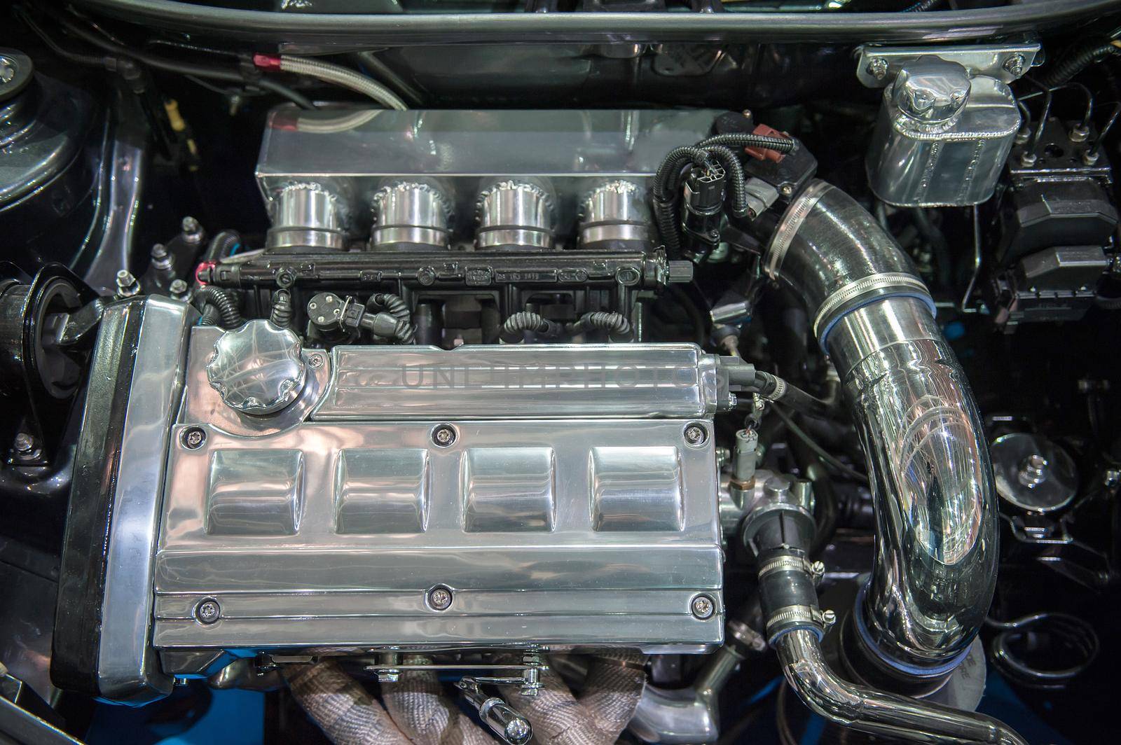 Close up of a modern chrome car engine