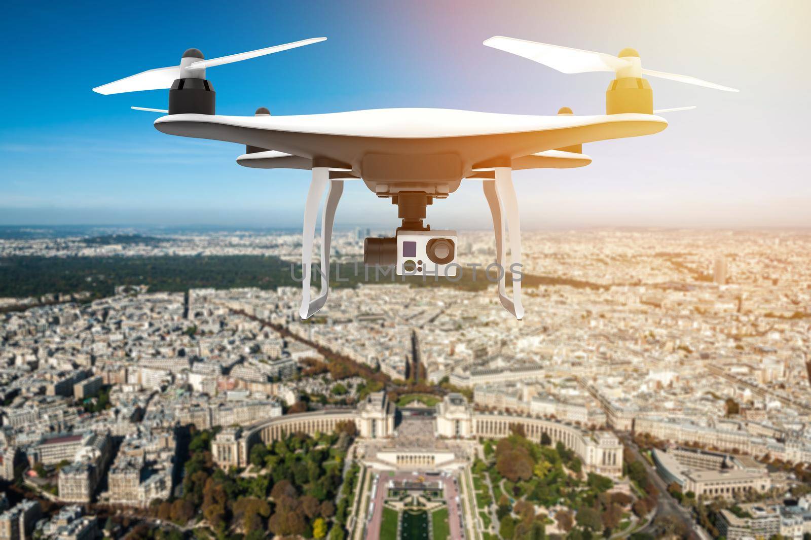 Drone with digital camera flying over a big city by cla78