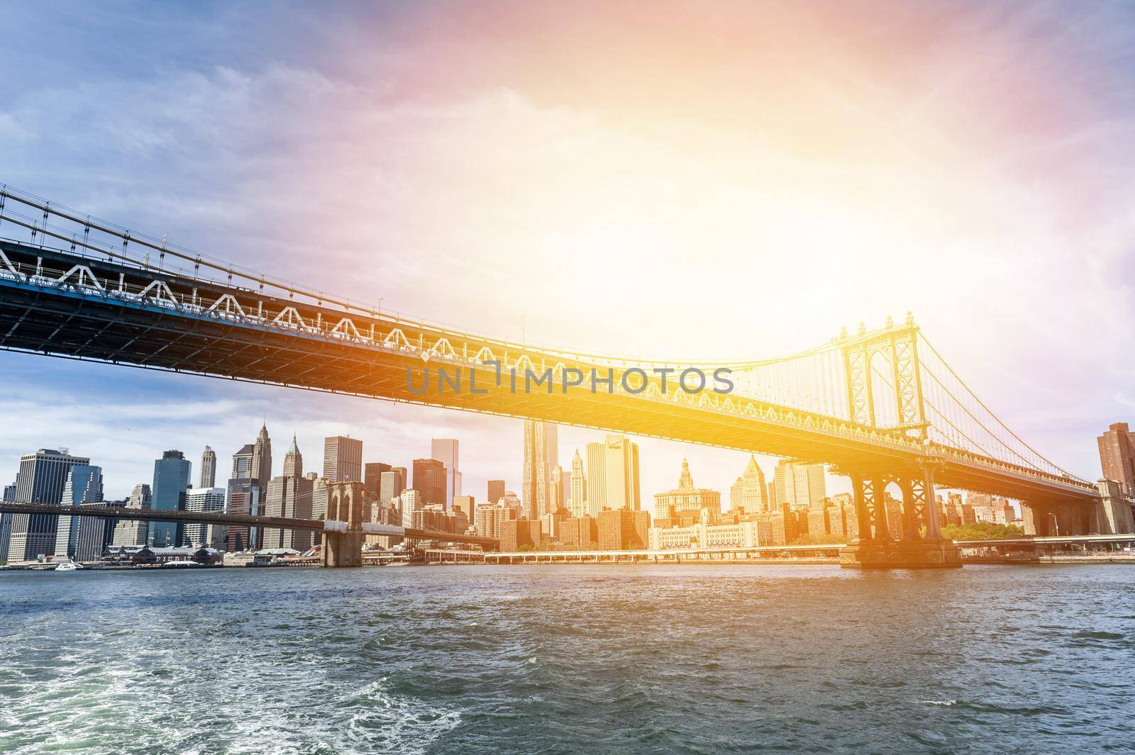 The Manhattan skyline and Manhattan Bridge at sunset, New York.