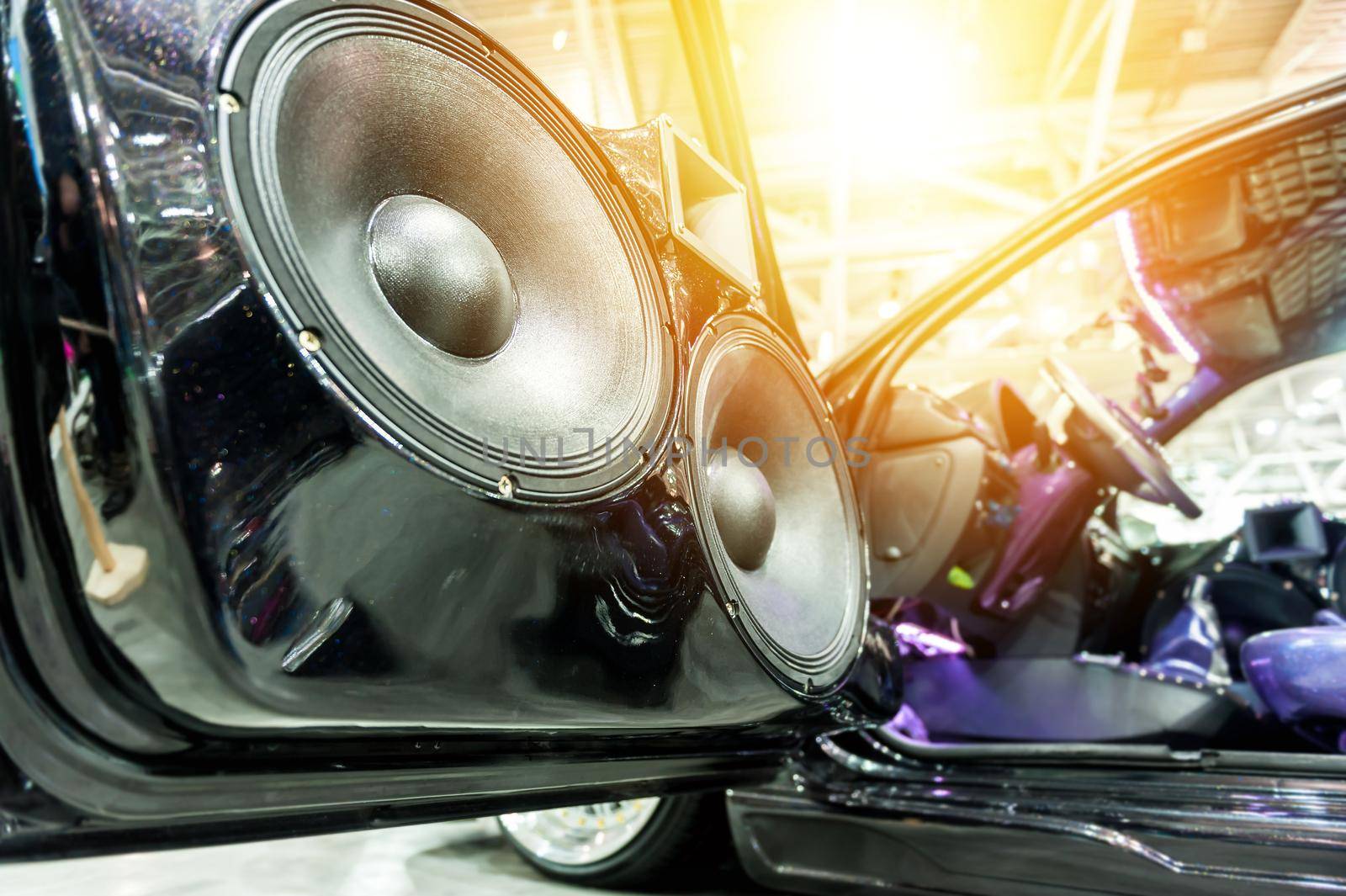 Speakers in a sport car in the sunlight