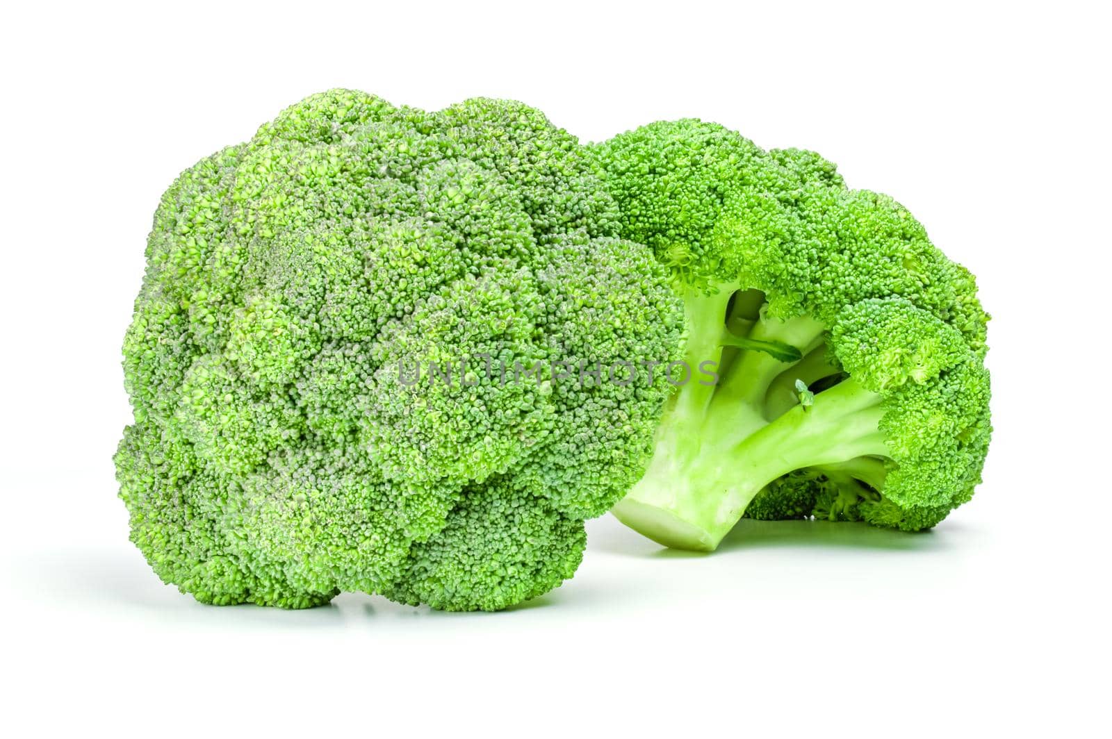 Two ripe broccoli cabbage isolated on white background by Proff