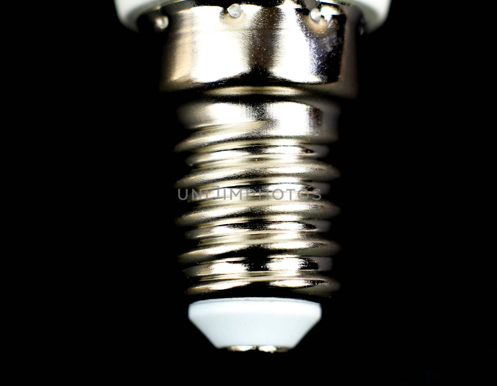 E14 Led bulb base on black background by soniabonet