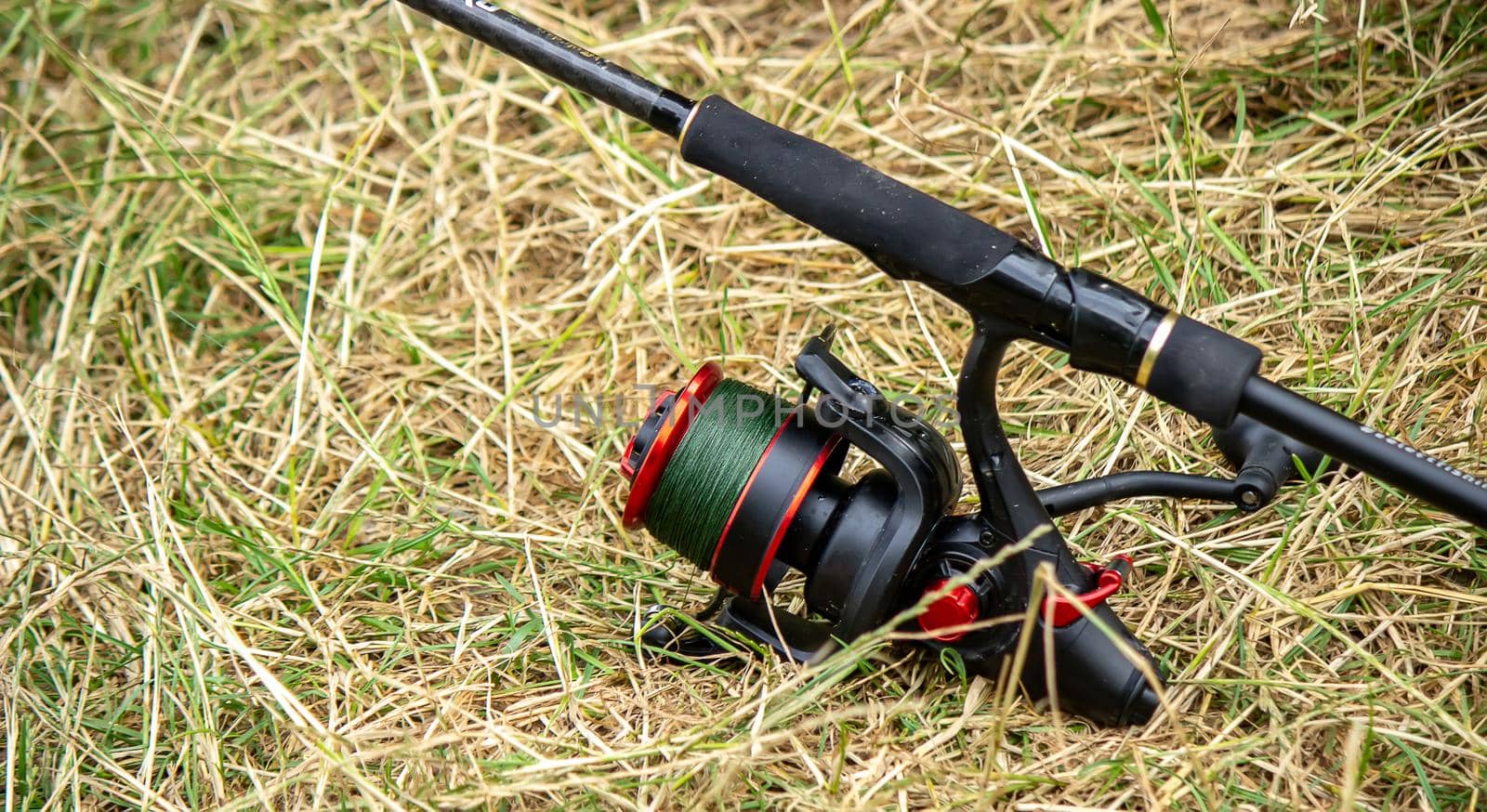 Fishing tackle on the river bank, bait rod, spinning rod, fish. Nature. Selective focus