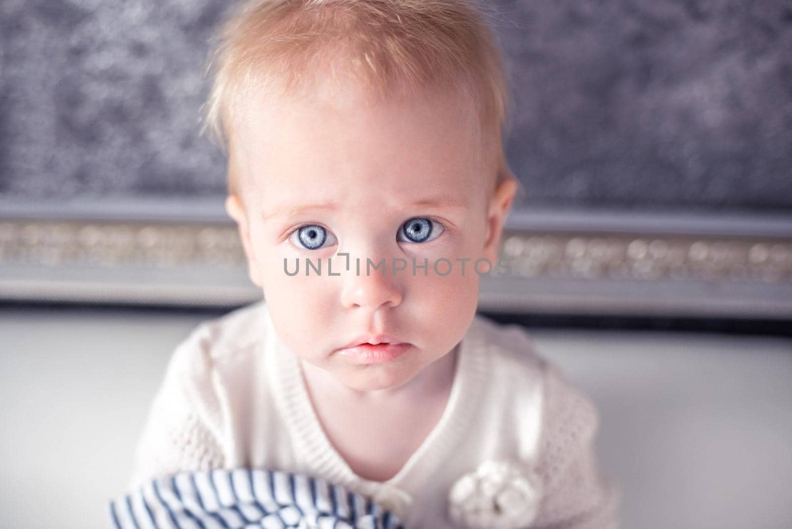 Adorable little baby with a blond hair and a blue eyes by Proff