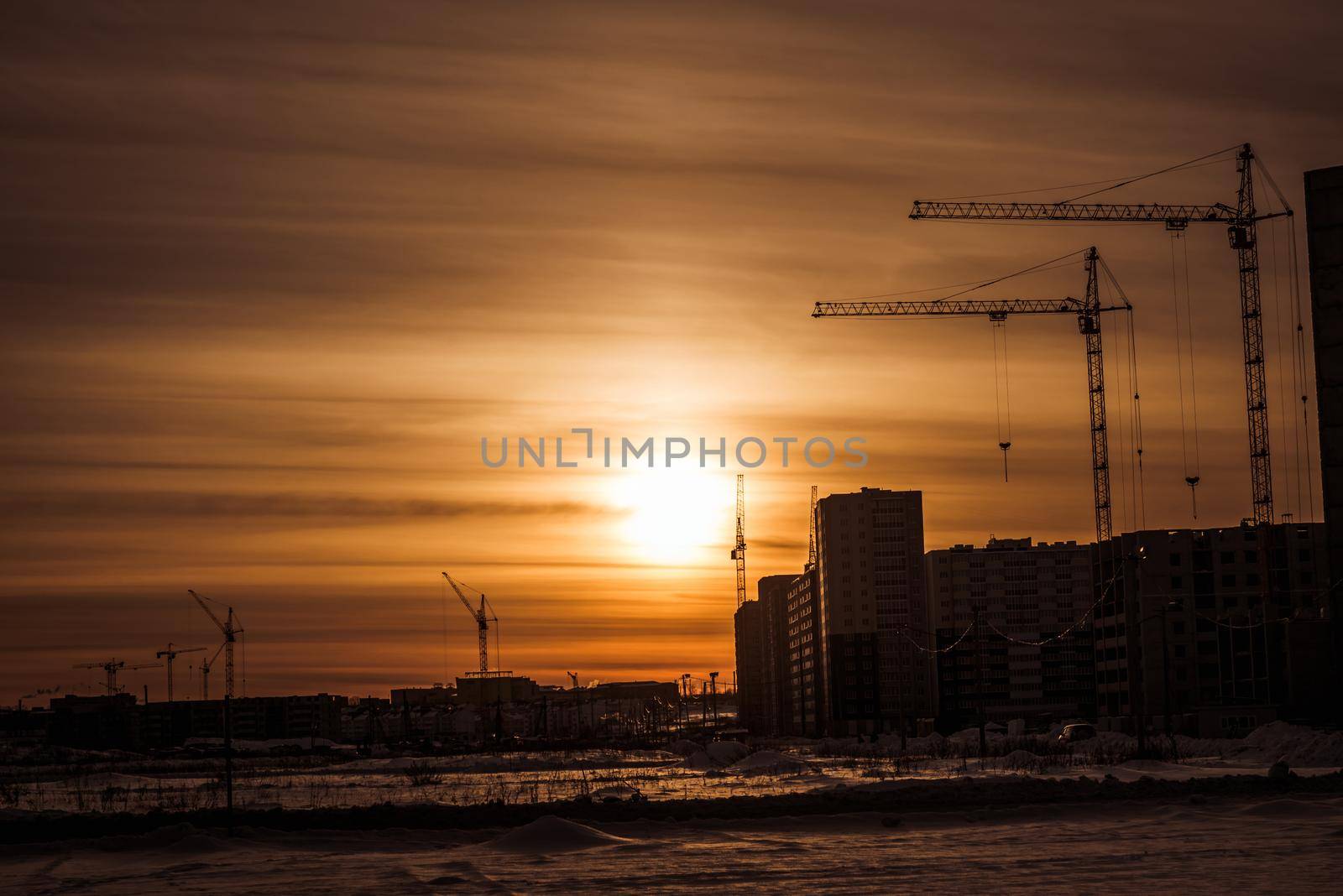 Tower cranes and building of new apartments by Proff