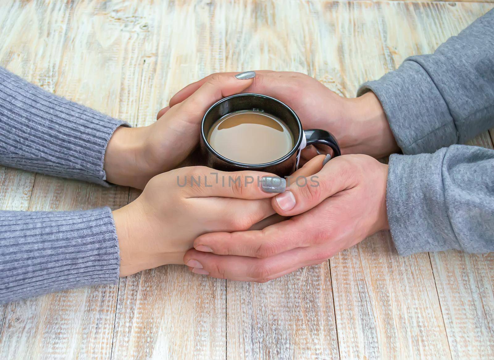 Concept of male and female hands, love and coffee