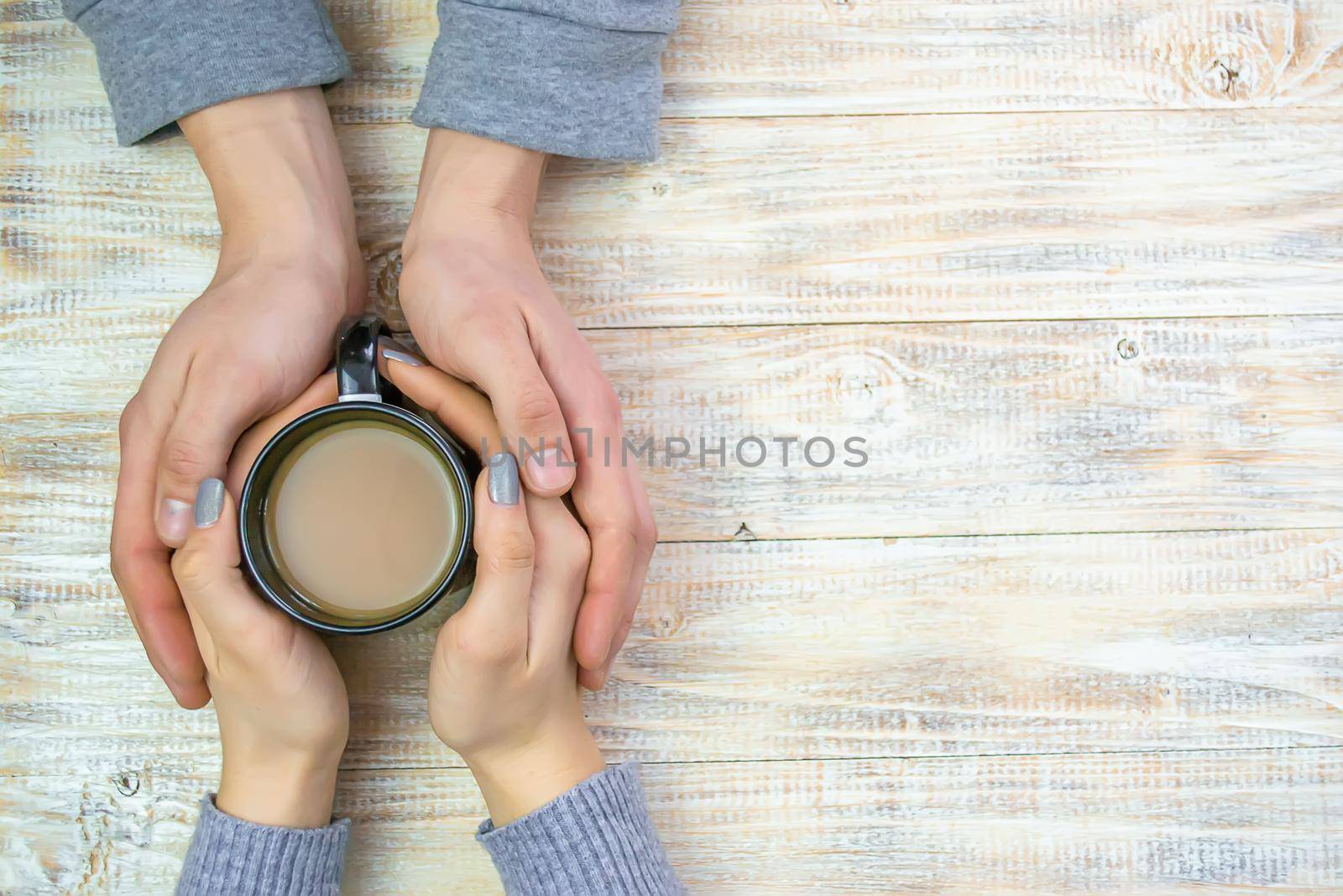 Concept of male and female hands, love and coffee by Anuta23