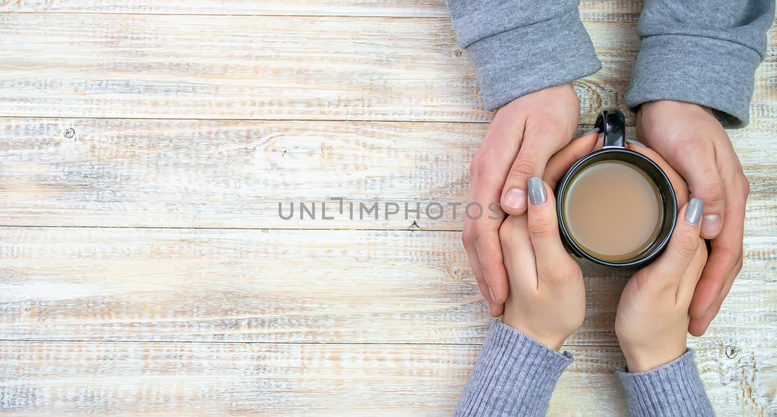 Concept of male and female hands, love and coffee