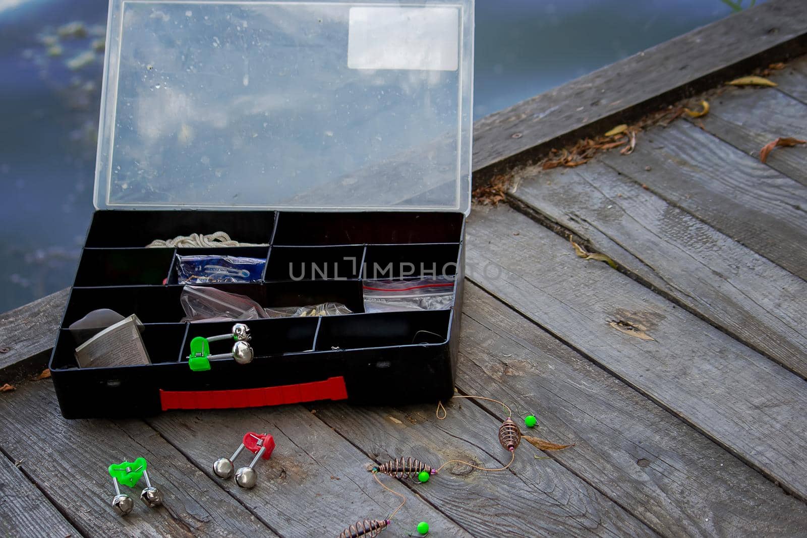 Fishing tackle on the river bank, bait rod, spinning rod, fish. Nature. Selective focus