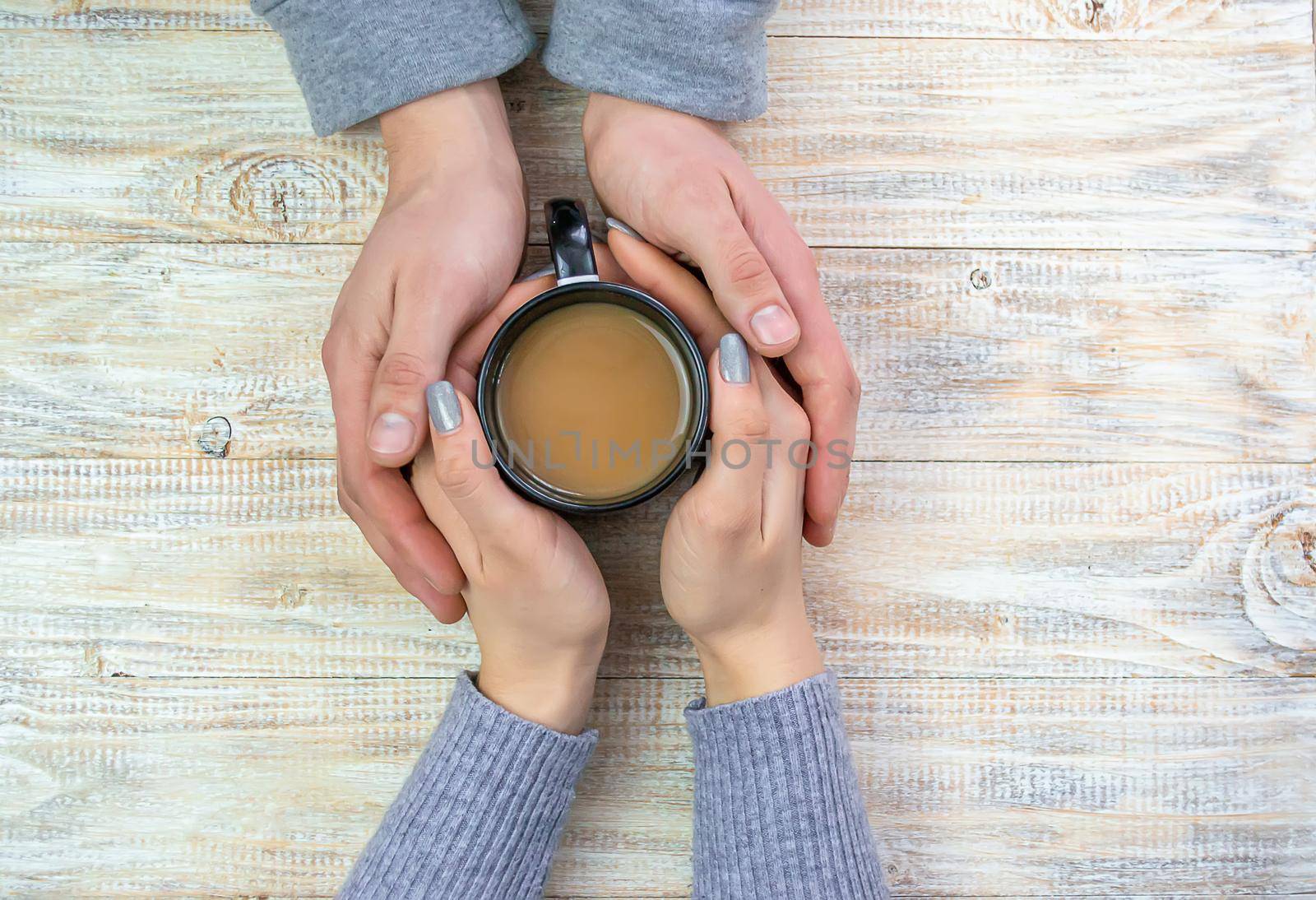 Concept of male and female hands, love and coffee