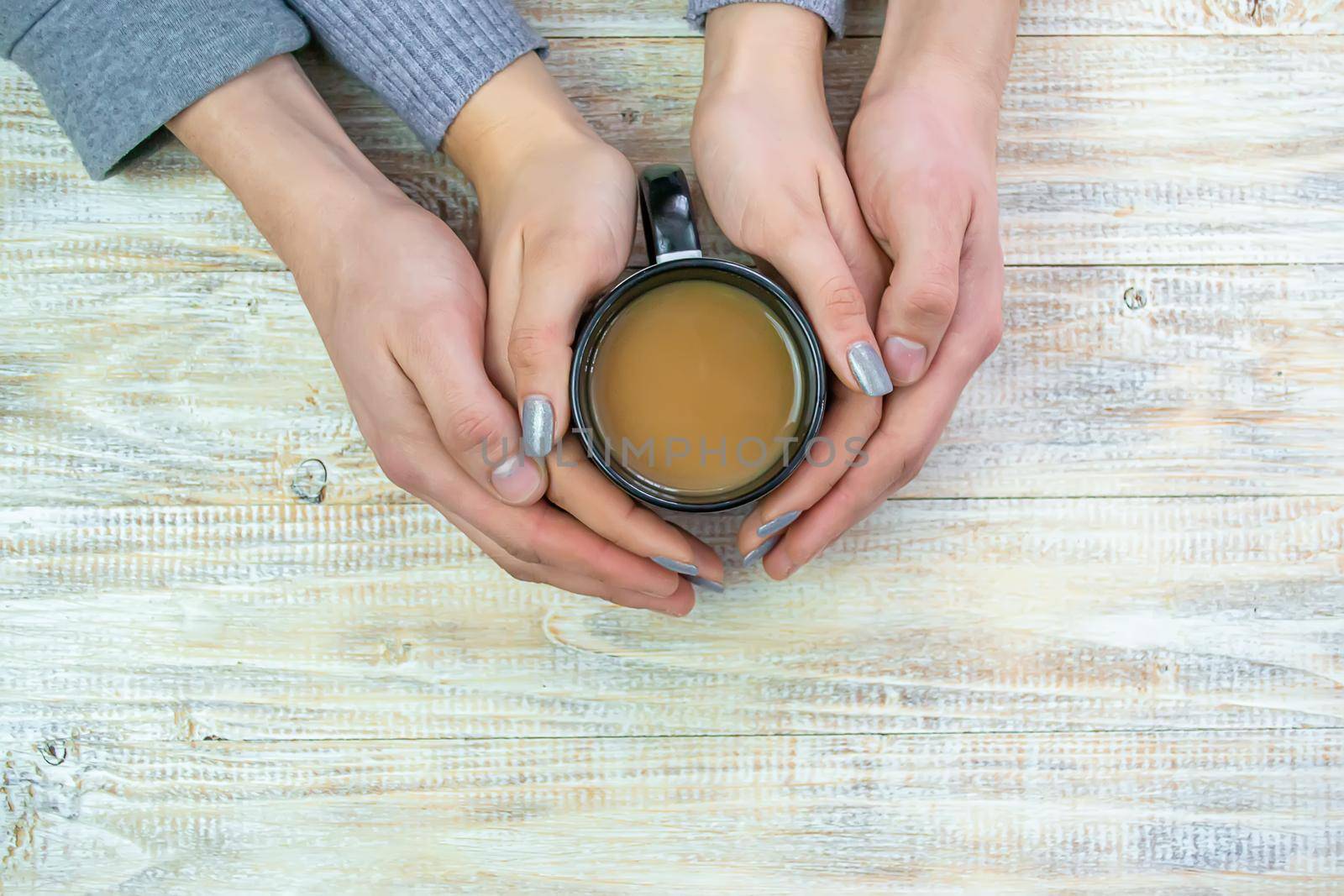 Concept of male and female hands, love and coffee