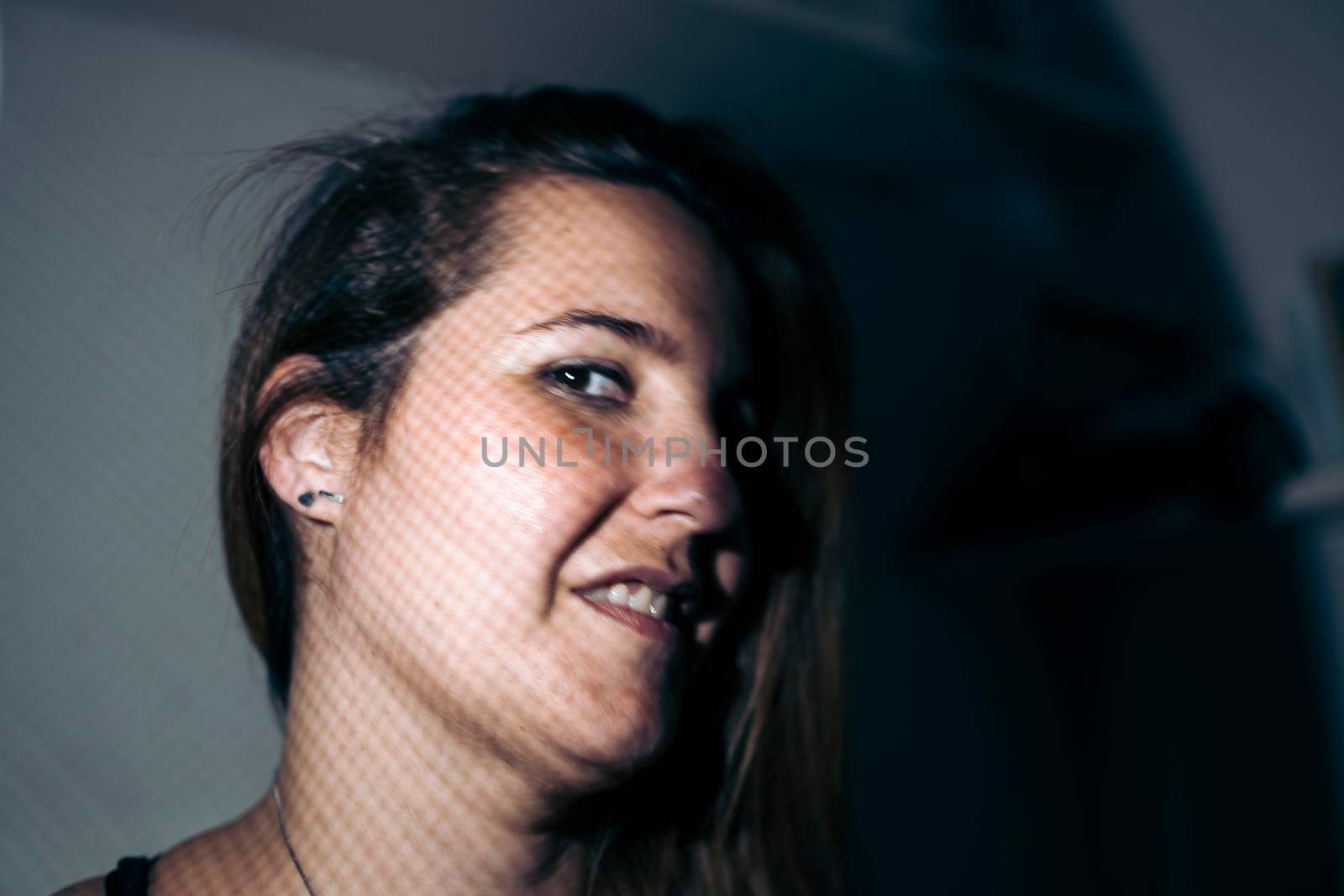 Portrait of the face of a young woman smiling by barcielaphoto