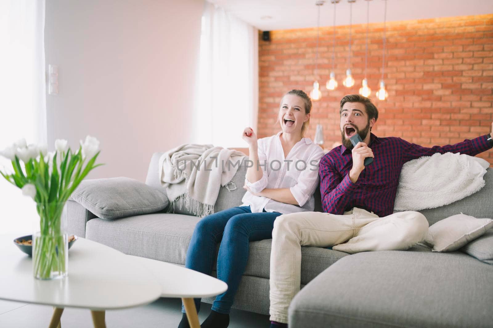 emotional couple watching tv