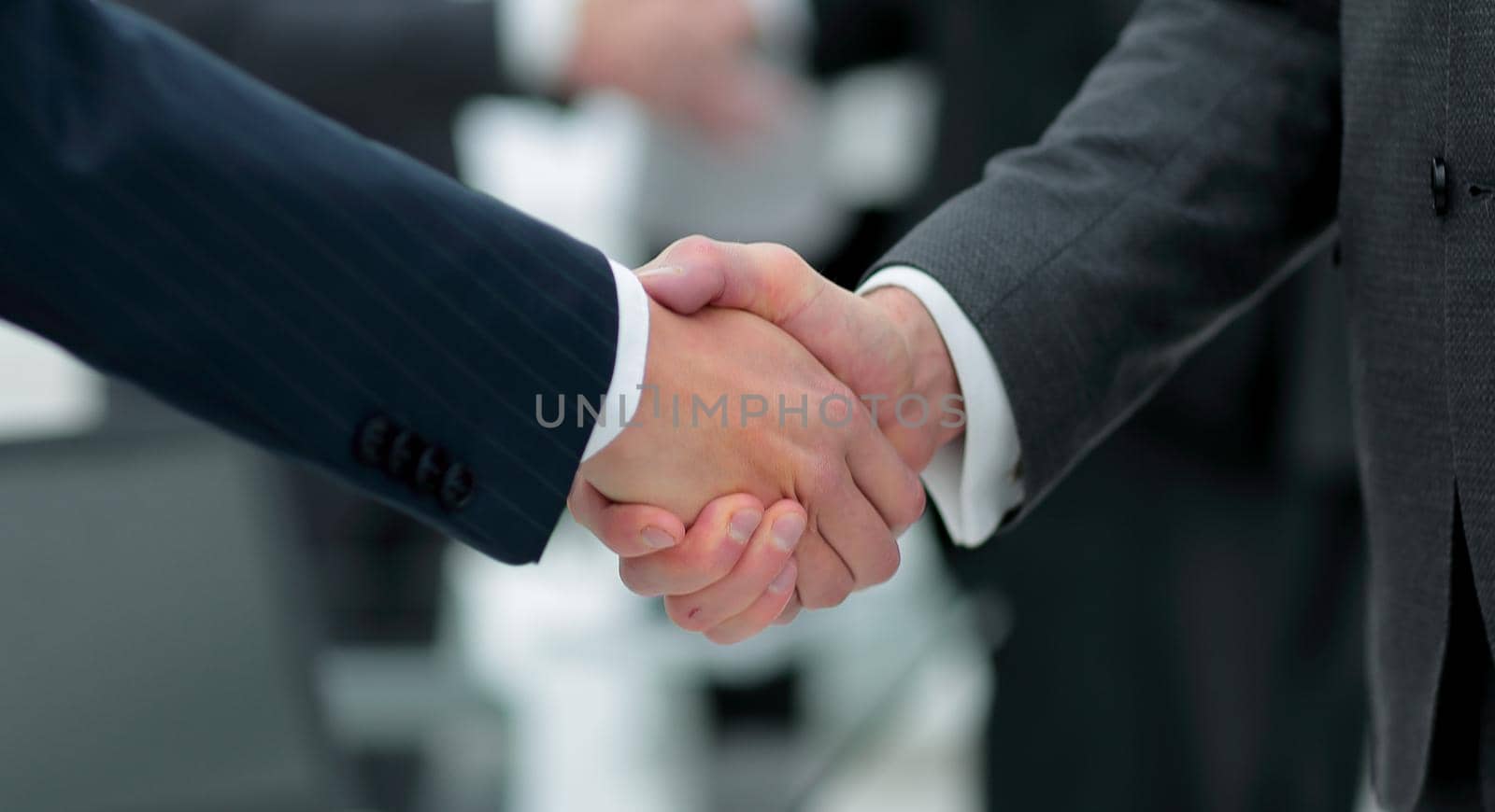 concept of cooperation.handshake of business partners by asdf