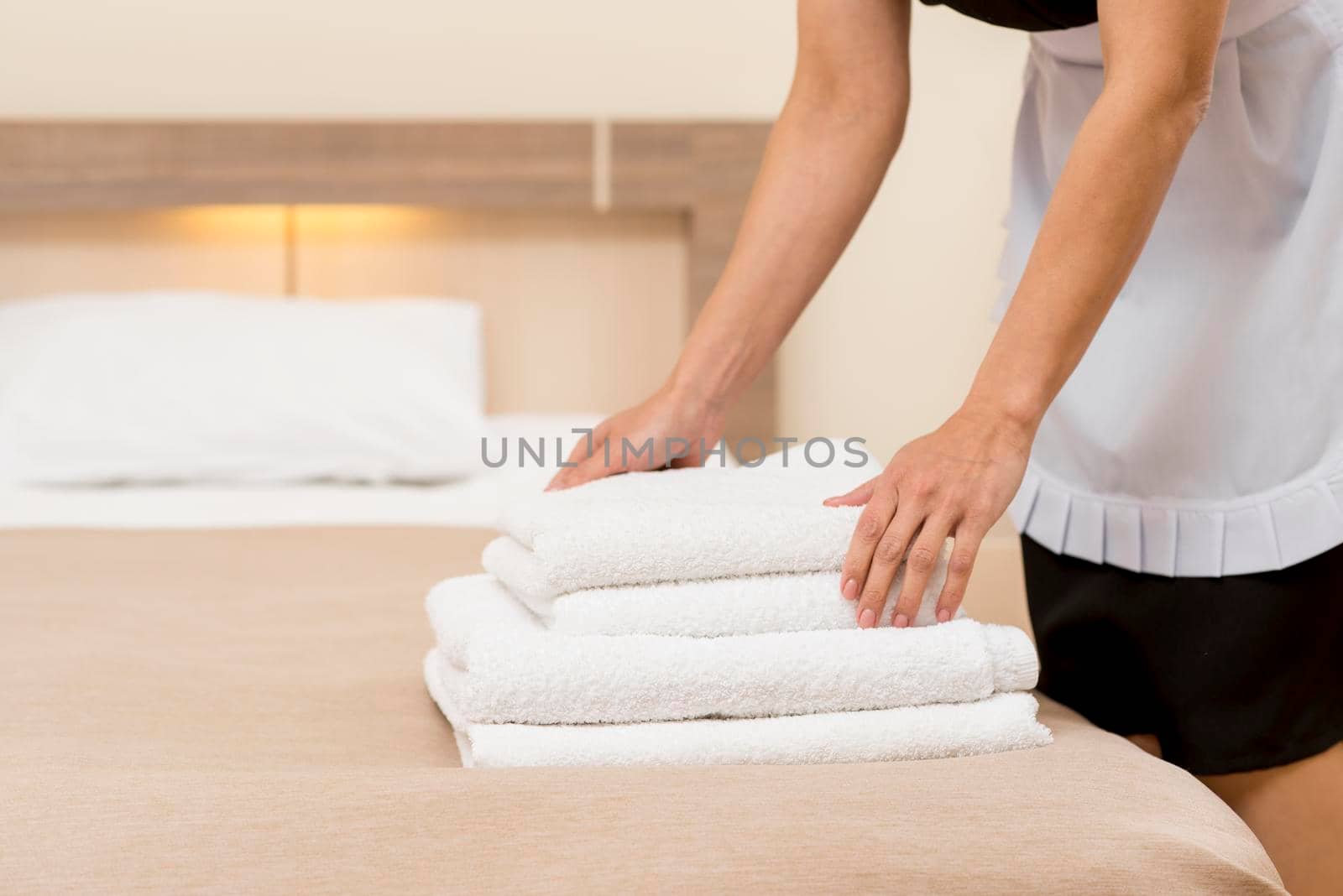 chambermaid preparing hotel room