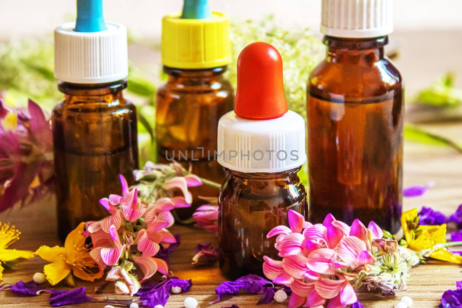 medicinal herbs, oils in small bottles homeopathy. selective focus. by mila1784