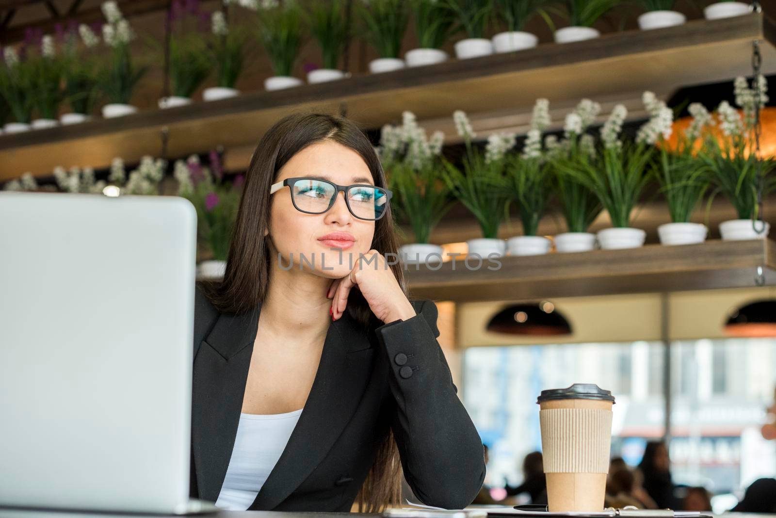 brunette businesswoman thinking