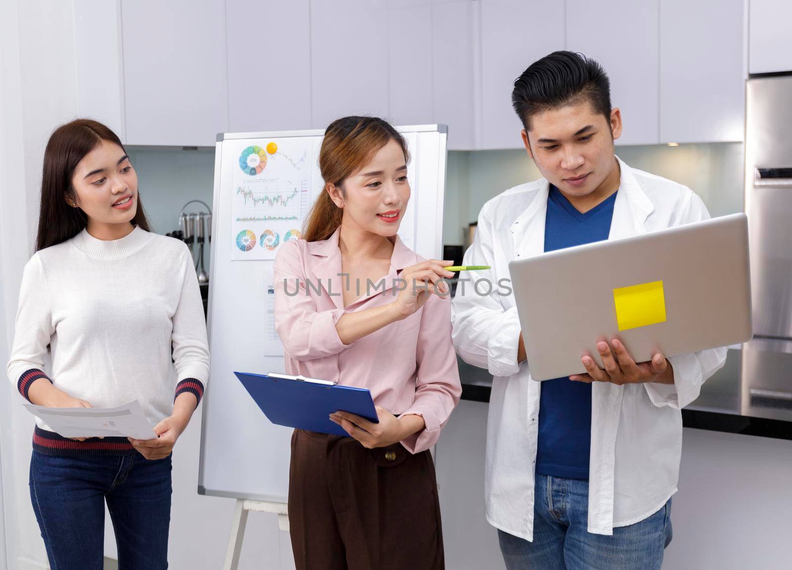 Business Team brainstorm meeting. Group of business people working at Private Home Office.Young business people working with laptop .Asian teamwork business people share idea with team at office