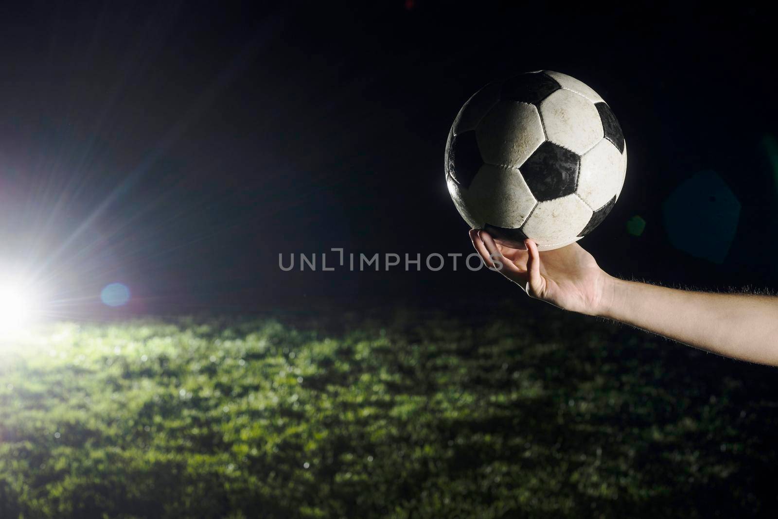 crop hand with soccer ball by Zahard