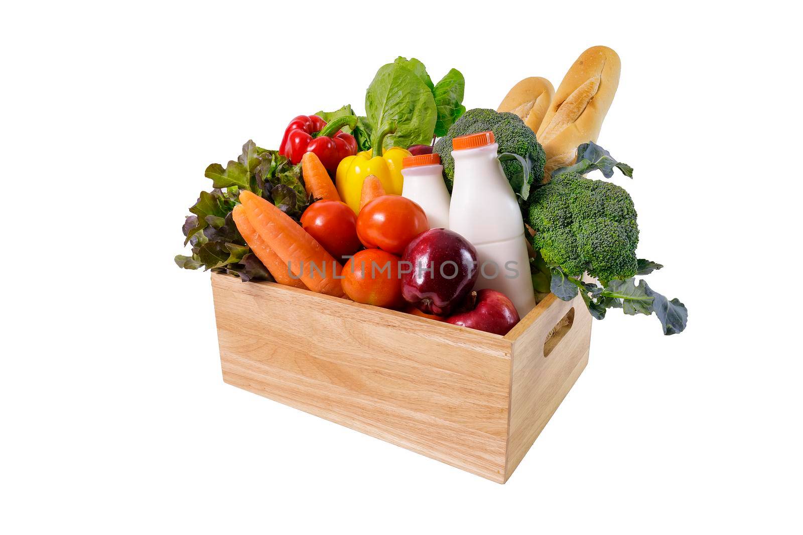 Wooden crate with multi collor vegetables , fruit, milk and baguette isolated on white background. Grocery in wood crate . Save with clipping path