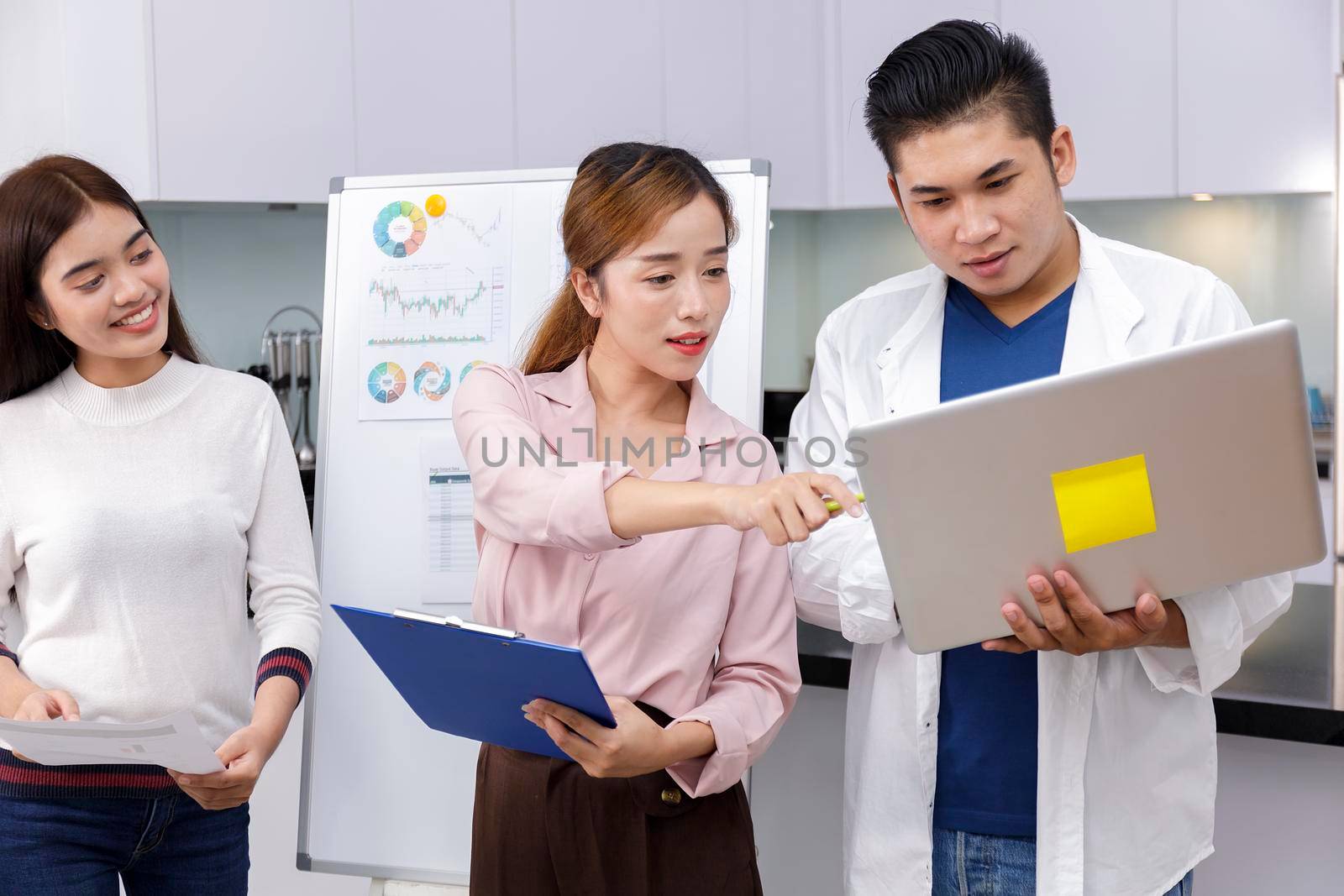 Business Team brainstorm meeting. Group of business people working at Private Home Office.Young business people working with laptop .Asian teamwork business people share idea with team at office