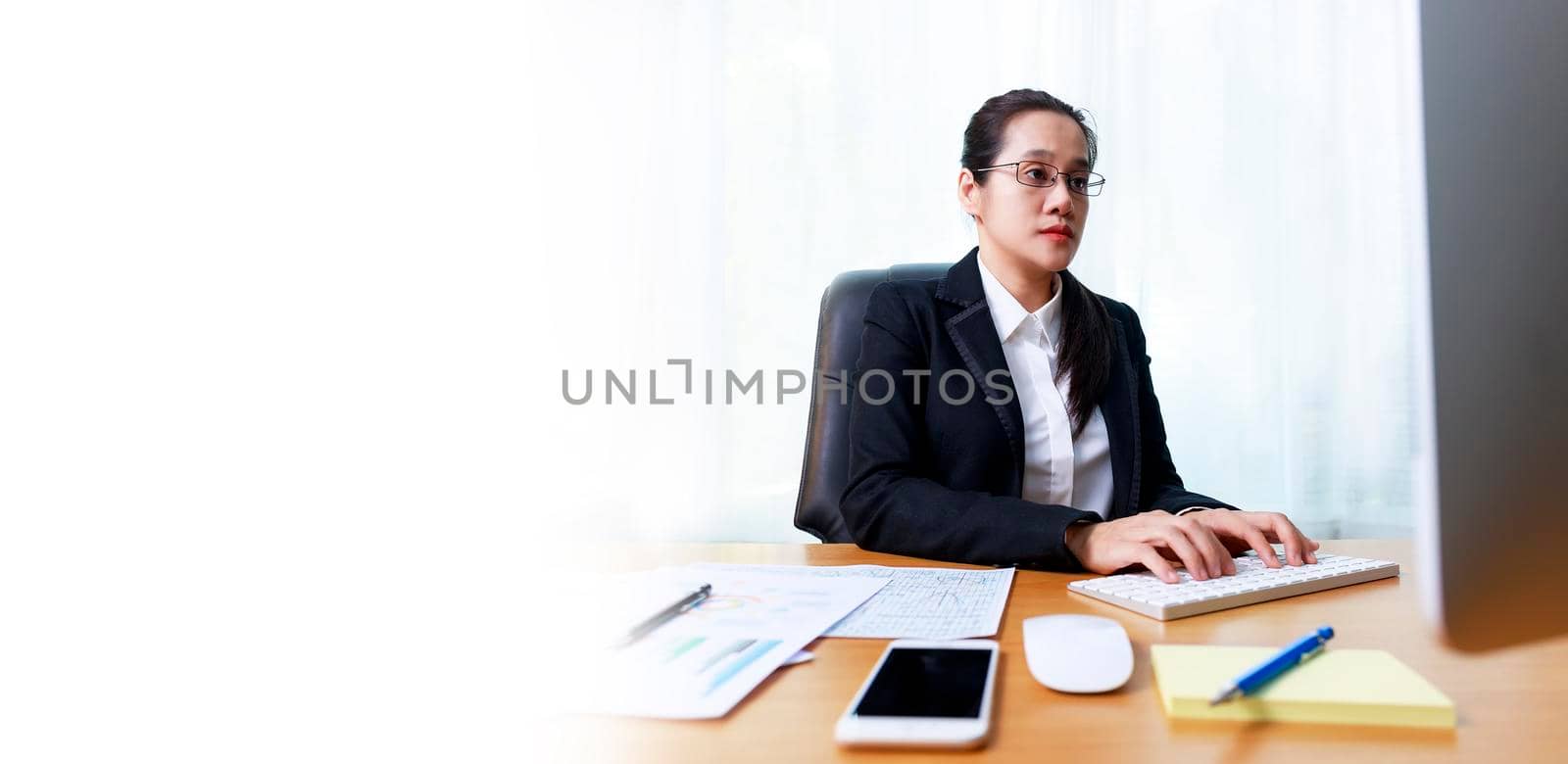 Asian business women analysis paper chart and typing keyboard insert data to computer at office. Business people working at home with internet. Banner