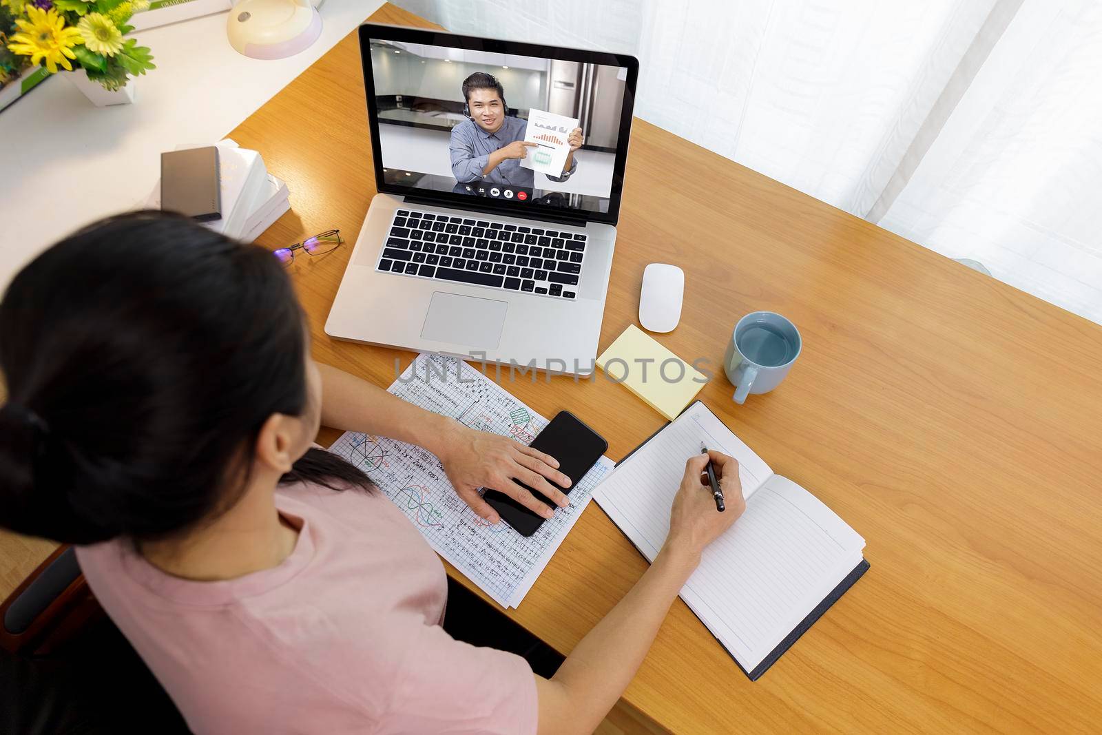 Business long distance video call, businessman and businesswoman analysis financial report using videoconference application for virtual communication, online meeting with videochat app. Covid-19 work from home.