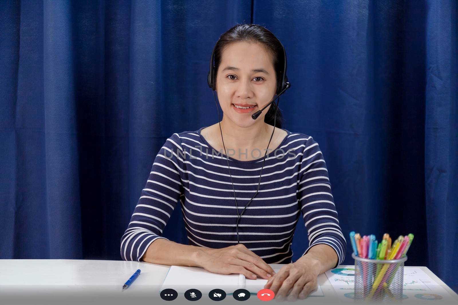 Screen of businesswoman talking with video call, video conference meeting at home. Business people working at home with online video call looking at camera