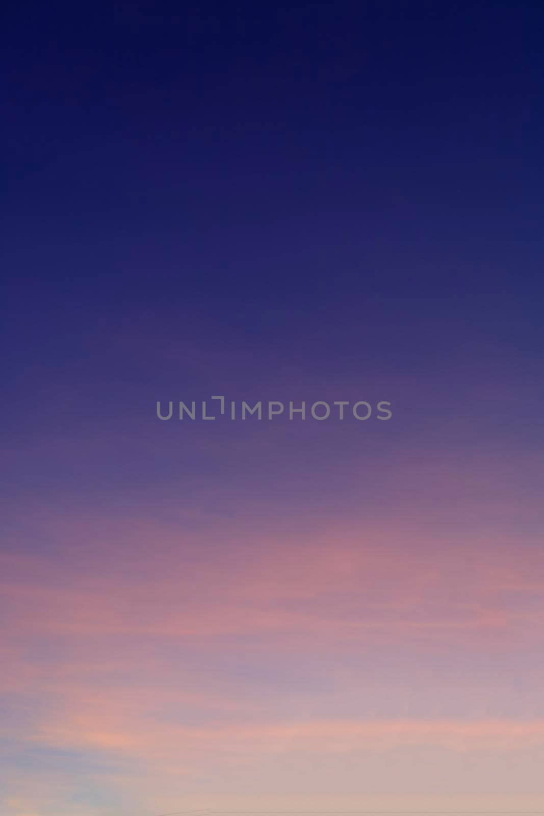 Beautiful morning clear sky background. Colorful yellow blue sky. Morning colorful clear blue sky background with soft white clouds sunrise or sunset.