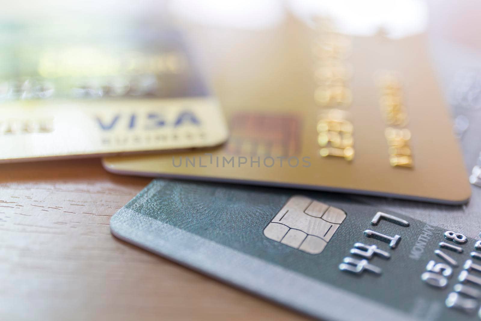Close up of credit card soft focus and selective focus for background. soft focus close up credit card on wood table background