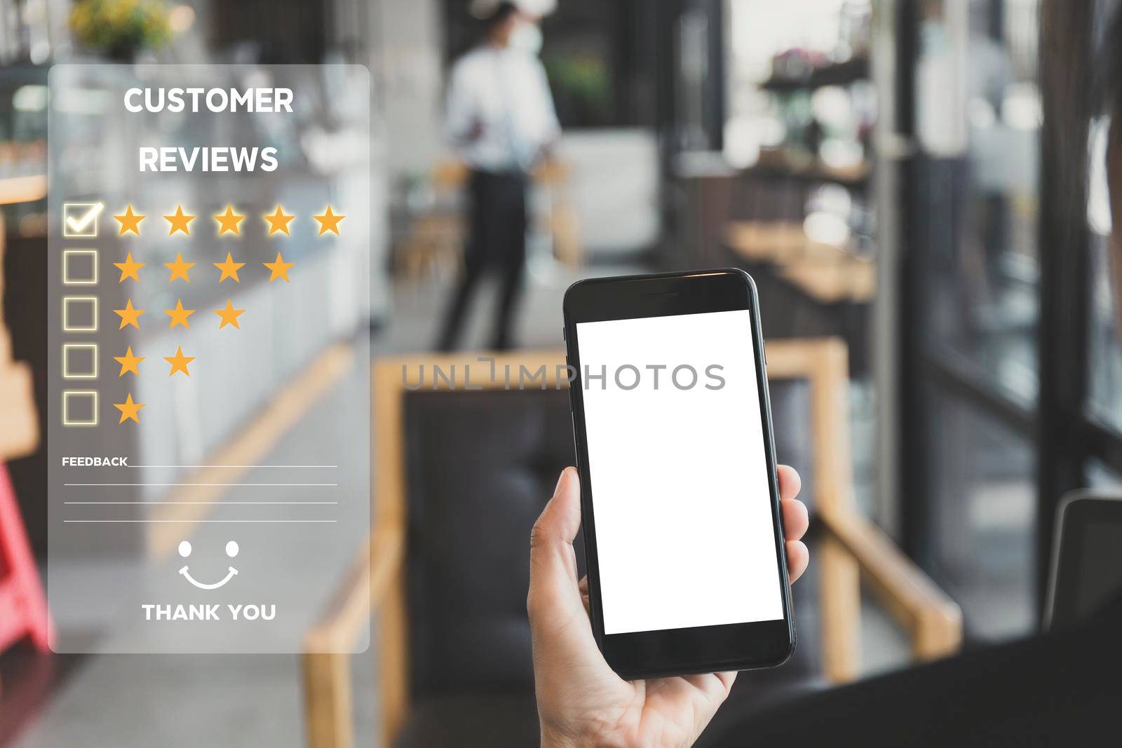Customer service and Satisfaction concept ,Women hand hold smart phone empty screen choose the 5 star icon to give satisfaction in service. rating very impressed in coffeeshop.