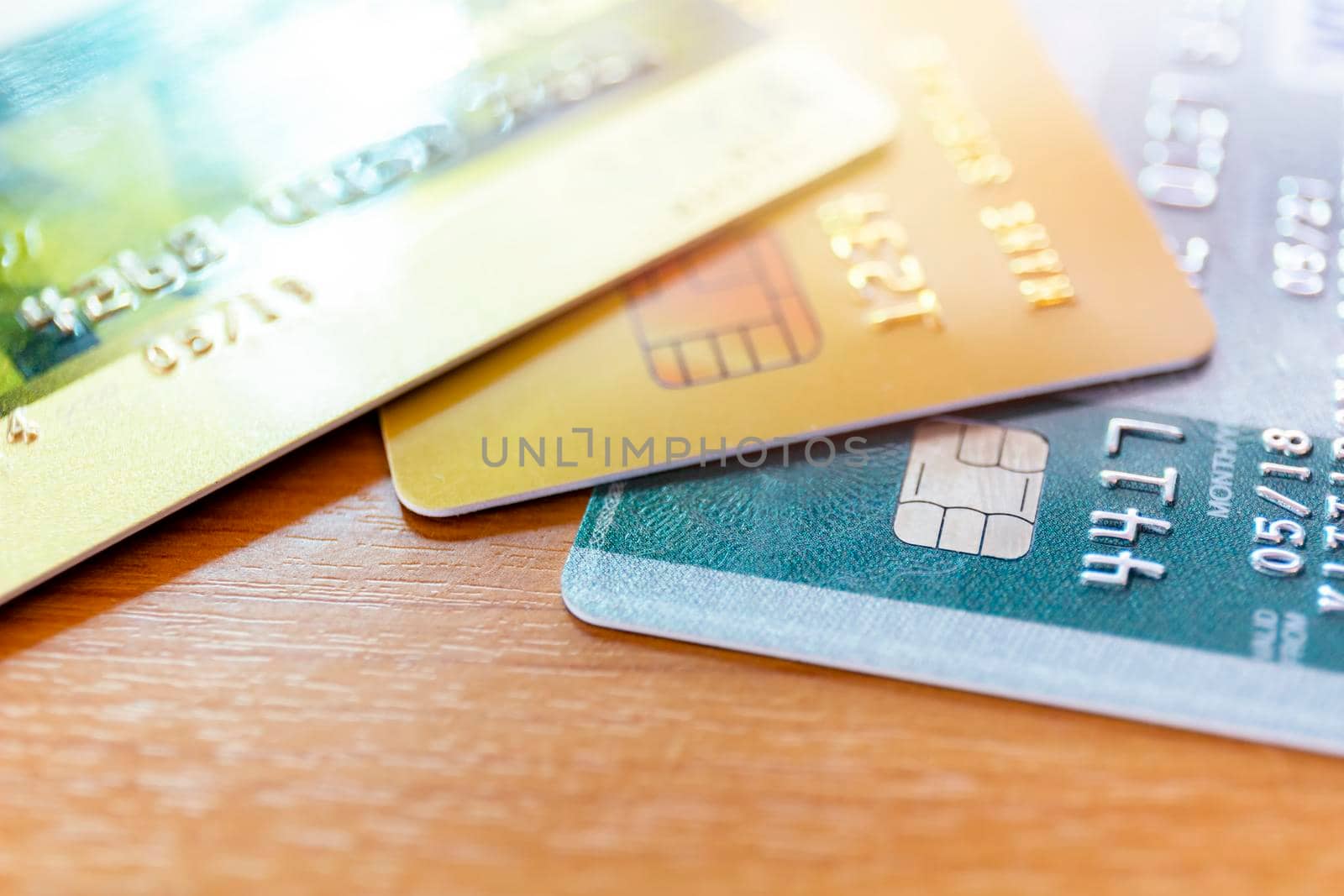 Close up of credit card soft focus and selective focus for background. soft focus close up credit card on wood table background