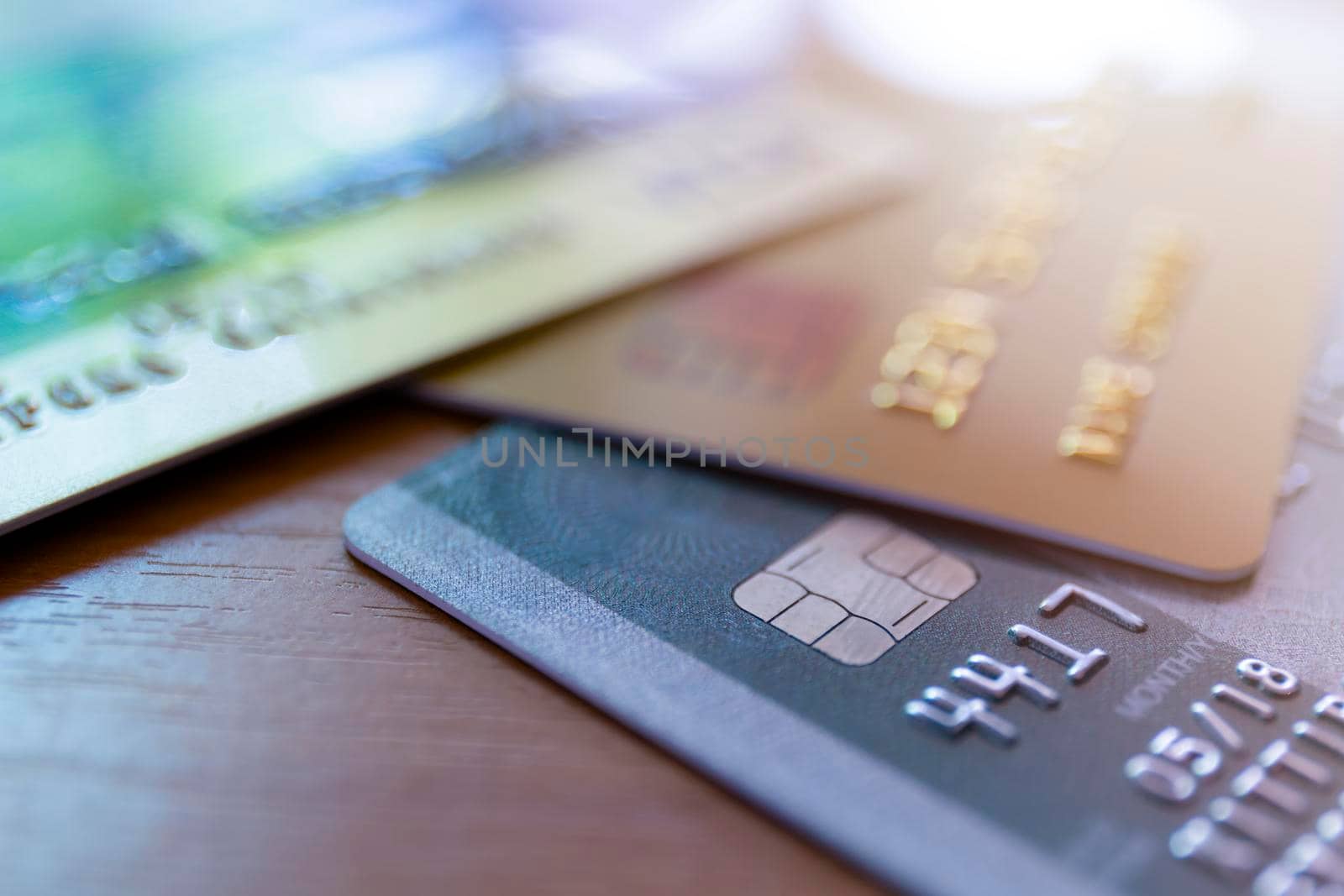 Close up of credit card soft focus and selective focus for background. soft focus close up credit card on wood table background