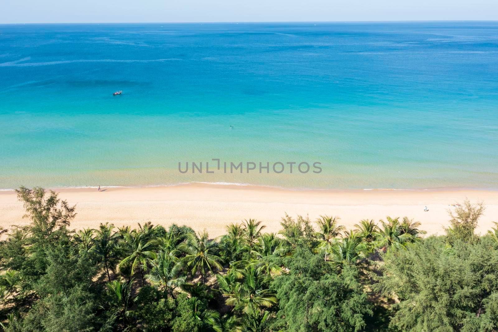 Aerial drone top down view crowd of people at tropical Beach with sunset in Phuket, Thailand, Beautiful Phuket beach is famous tourist destination at Andaman sea. Top view happy people play on the beach